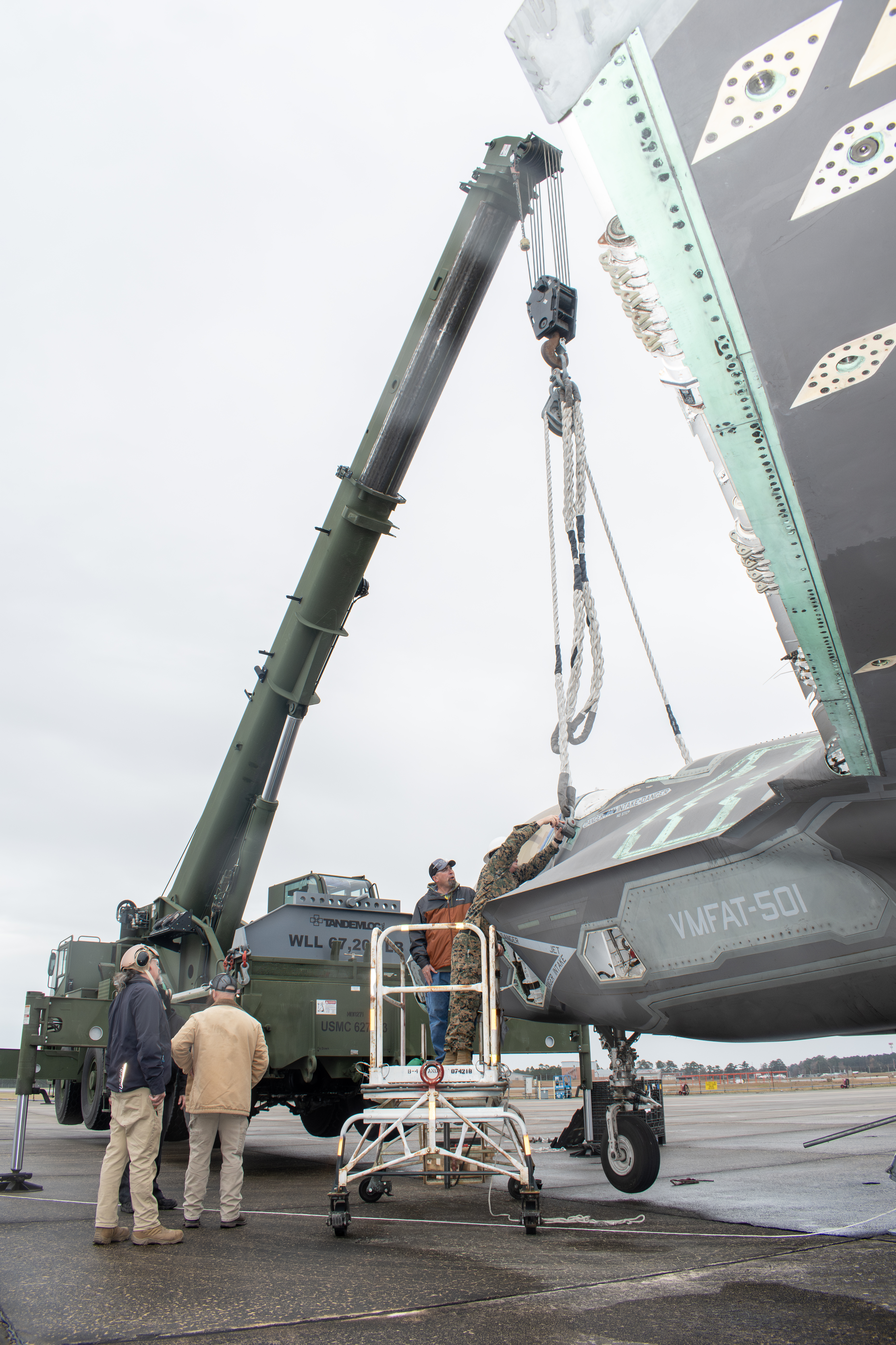 Marines use crane to lift decommissioned F-35 airframe