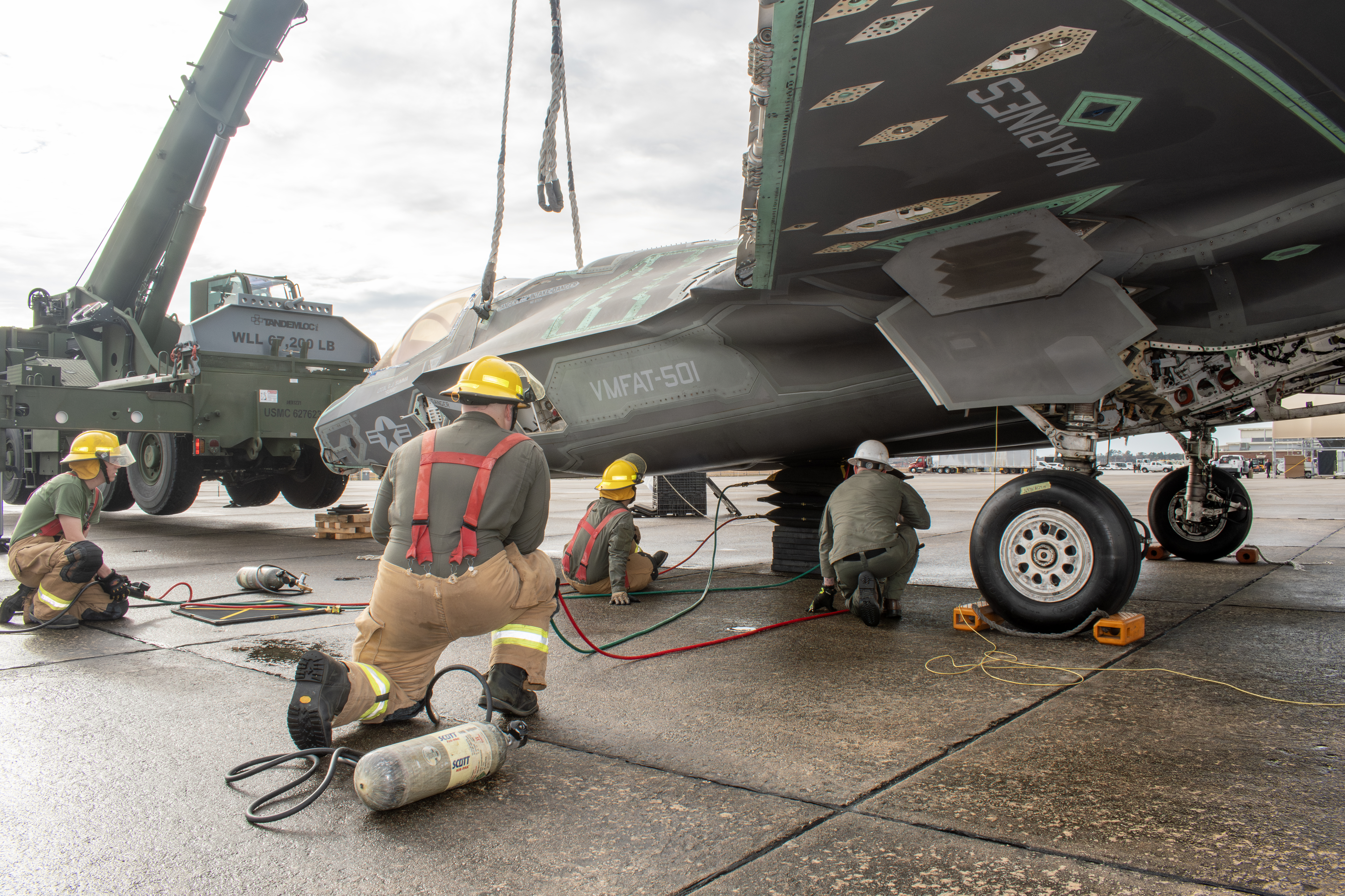 Marines use crane to lift decommissioned F-35 airframe