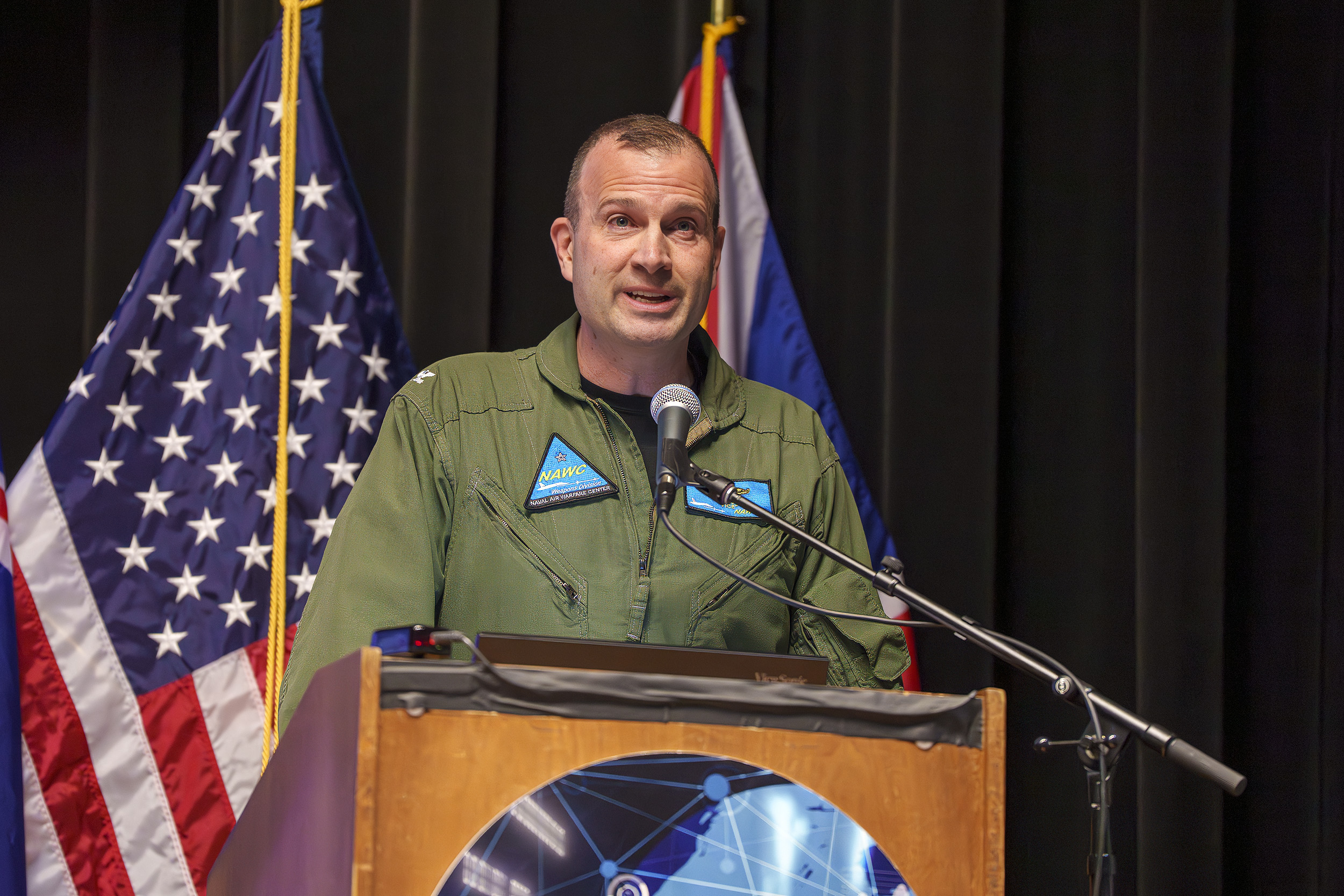 Capt. Jon Rugg, vice commander of Naval Air Warfare Center Weapons Division, delivers opening remarks at Naval Base Ventura County Point Mugu, March 10, 2026. 