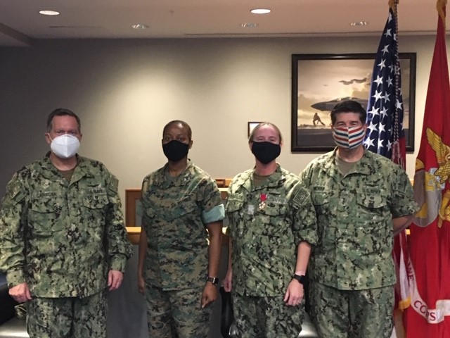 Rear Adm. Shane Gahagan, Marine Corps Col. Tamara Campbell, Capt. Laura Schuessler, Vice Adm. Mike Moran