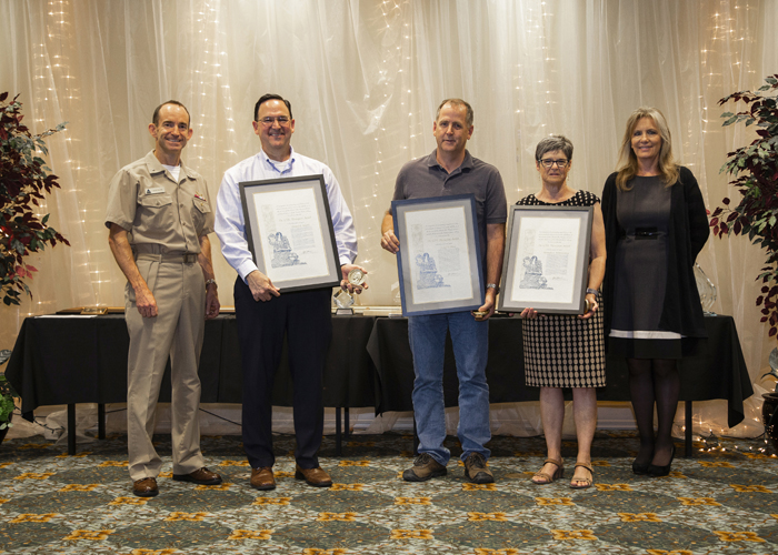 Winners of the Dr. L.T.E. Thompson Memorial Award accept their certificates from Rear Adm. Scott Dillon, NAWCWD commander, and Joan Johnson, NAWCWD executive director, during the 2019 Honorary Awards Ceremony at China Lake on June 25. (U.S. Navy photo by Ryan Smith)