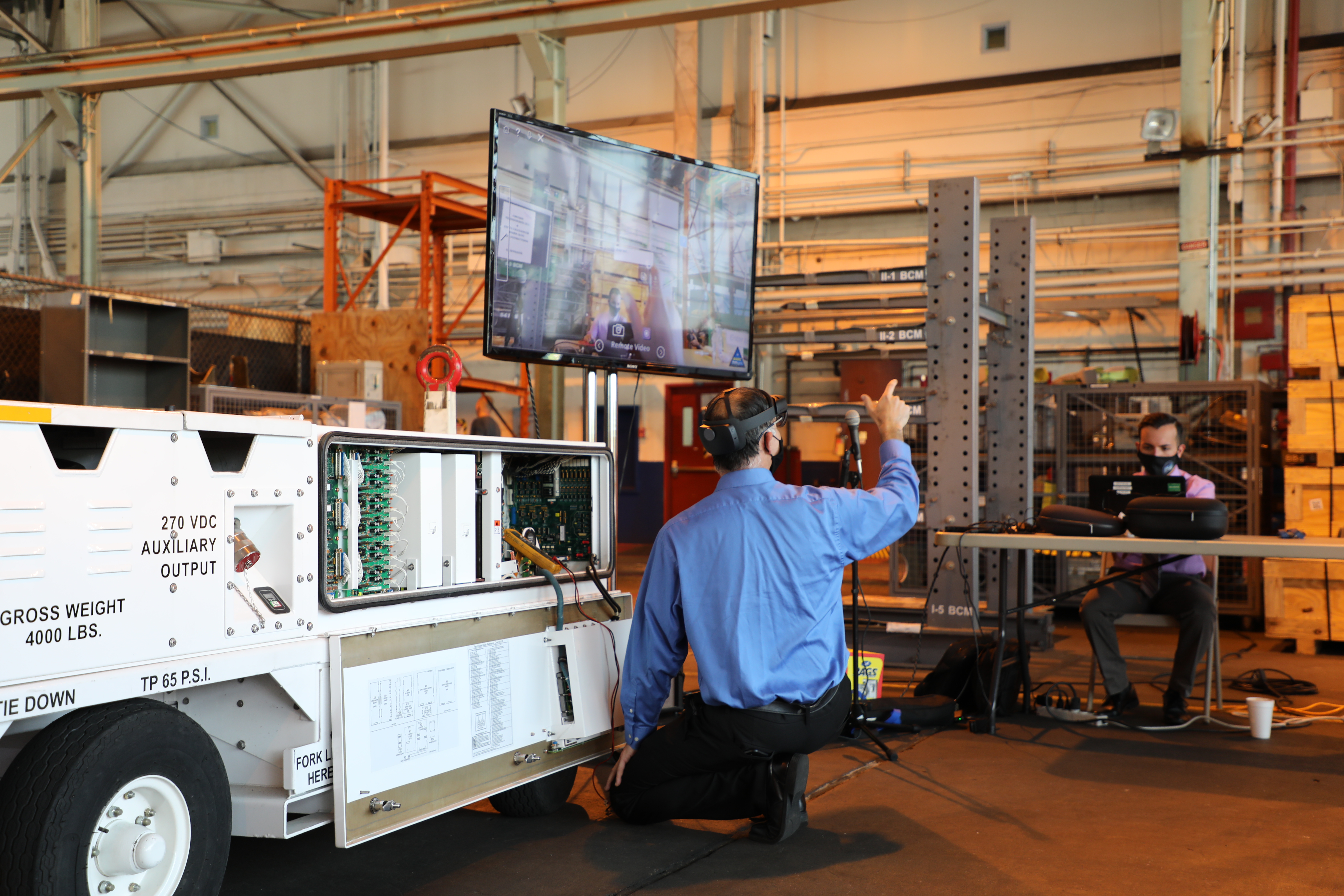 Navy engineers demonstrate the Augmented Reality Remote Maintenance Support Service during a recent technology exercise
