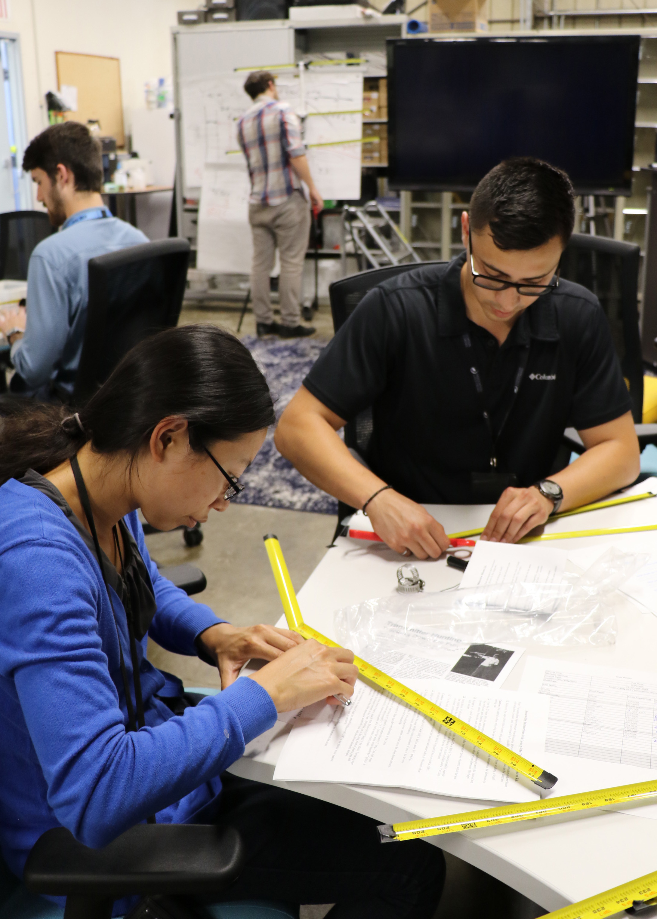 Diane Phung and Jesus Ramos assemble home-made Yagi antennas during a two-day “Fox Hunt” class 