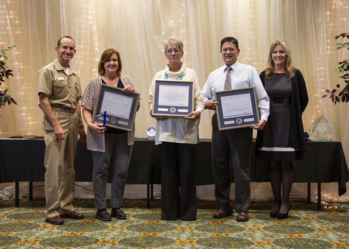 Winners of the Business Management Excellence Individual Award accept their certificates from Rear Adm. Scott Dillon, NAWCWD commander, and Joan Johnson, NAWCWD executive director, during the 2019 Honorary Awards Ceremony at China Lake on June 25. (U.S. Navy photo by Ryan Smith)
