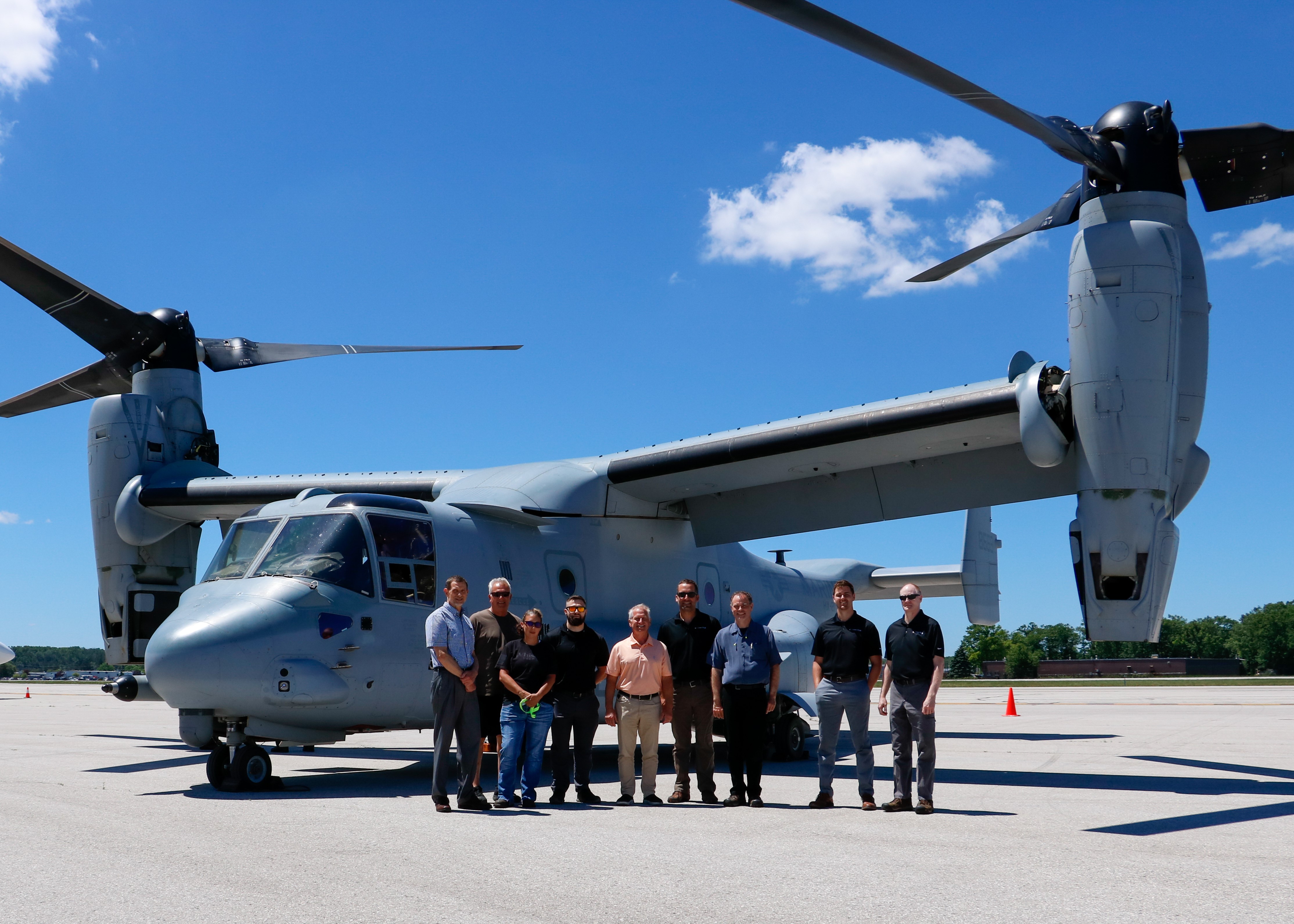Members of the Cone Drive team pose with the MV-22 during a static display