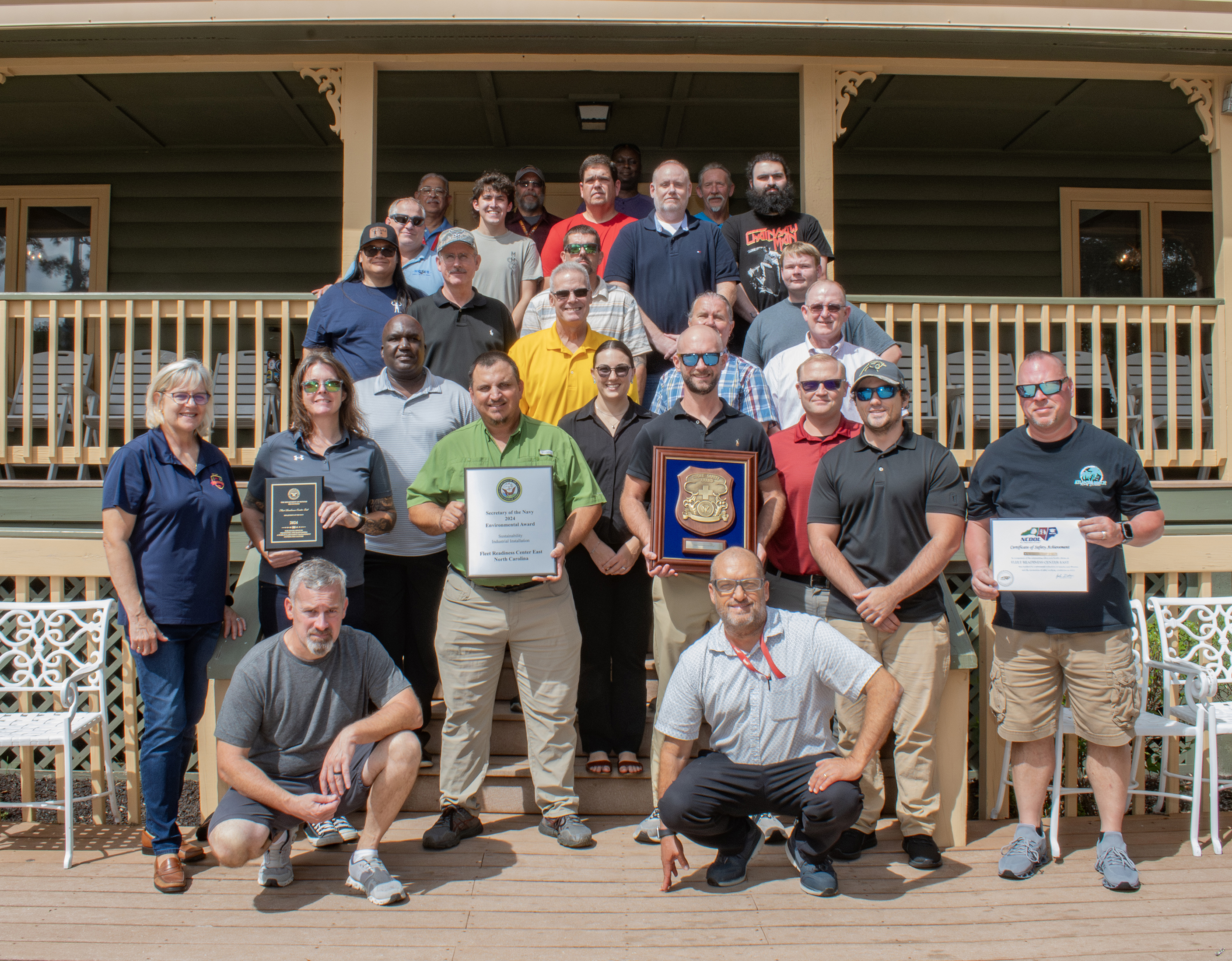 Group of people pose with awards 