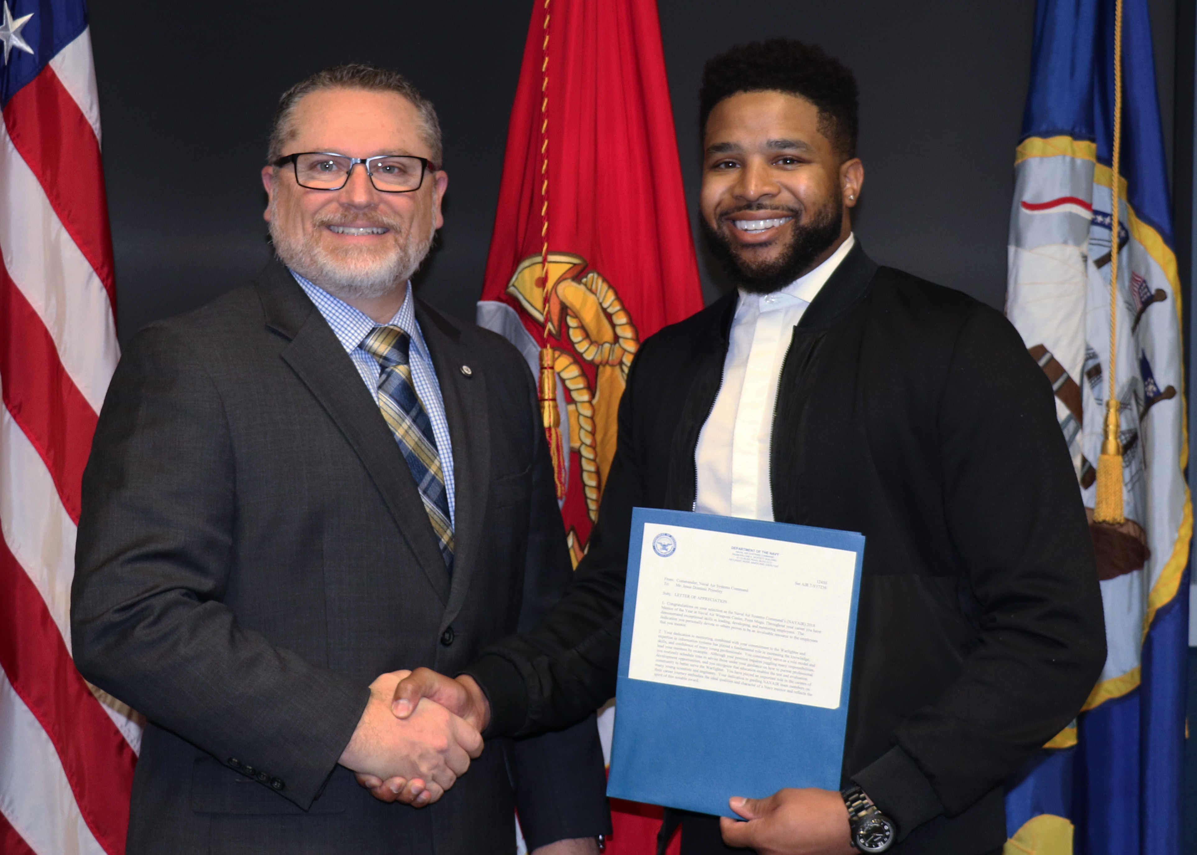 Dominic Priestley, right, NAVAIR’s Mentor of the Year in Point Mugu, California, poses with Tom Dowd, NAVAIR Ranges Director, after a Jan. 31 ceremony honoring mentors from across NAVAIR. (U.S. Navy photo)