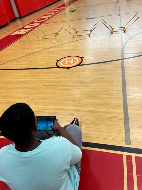 A student flying a drone