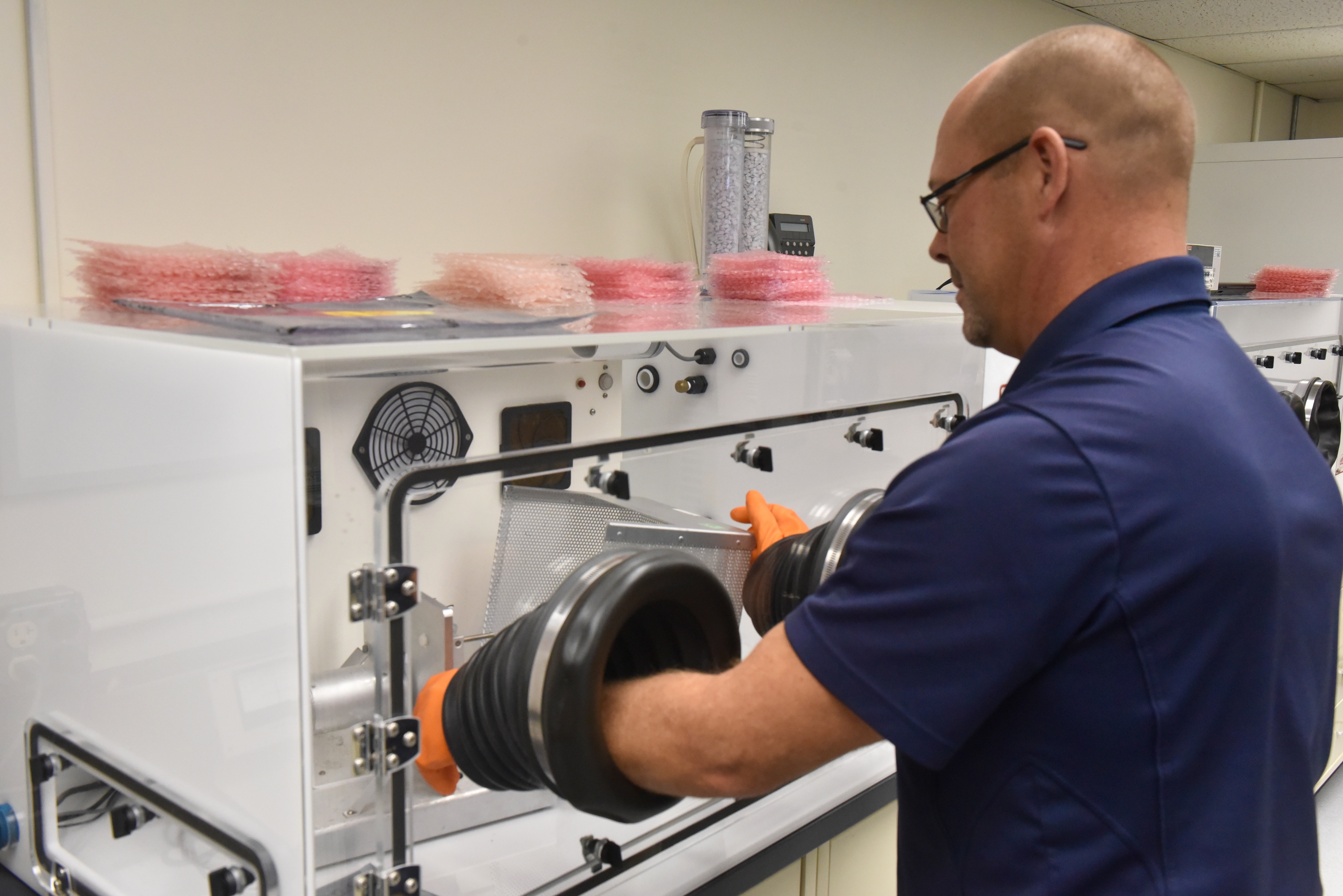 Mechanical engineer Michael Ruff using a piece of equipment