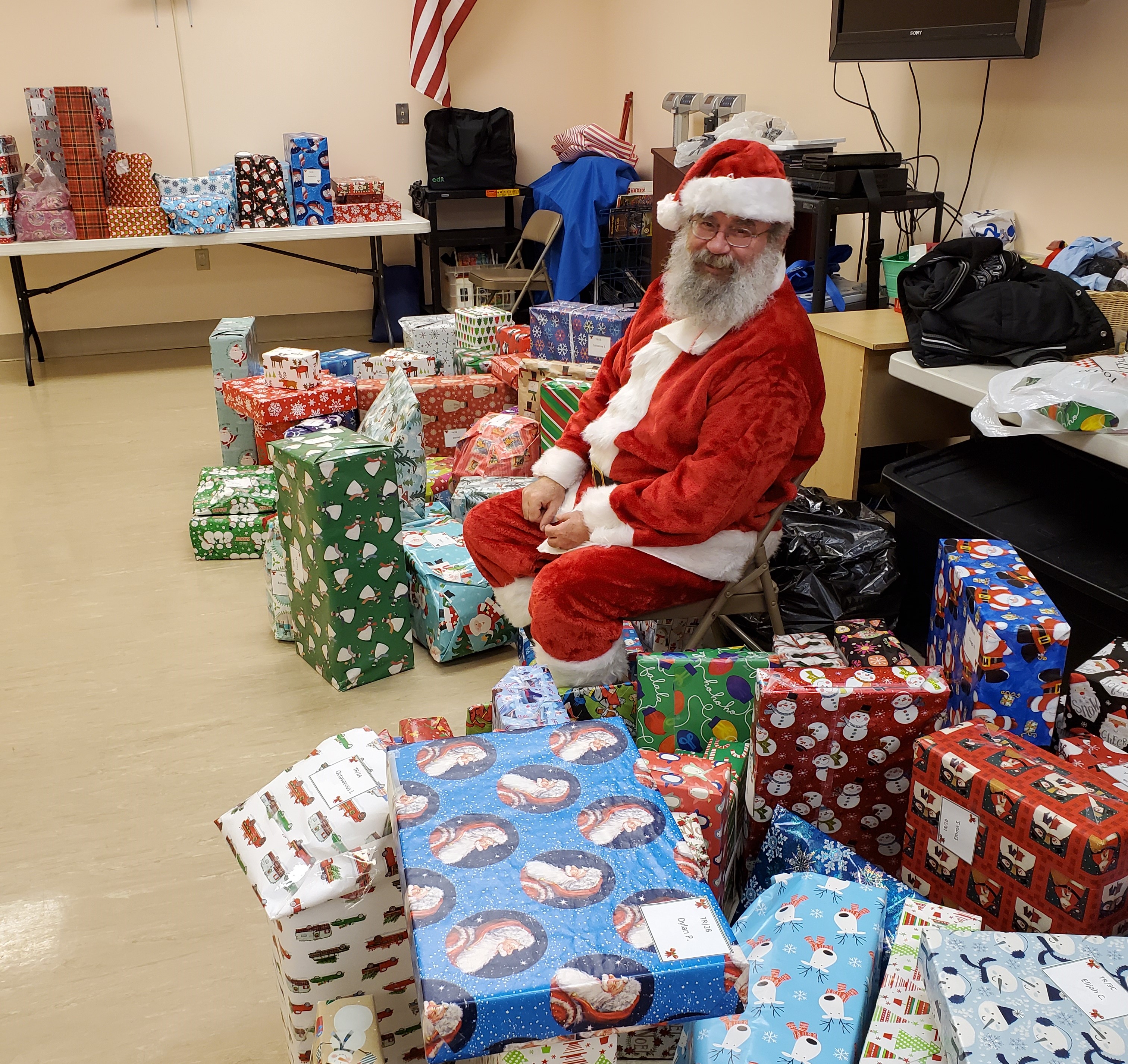 Santa with the Giving Tree gifts