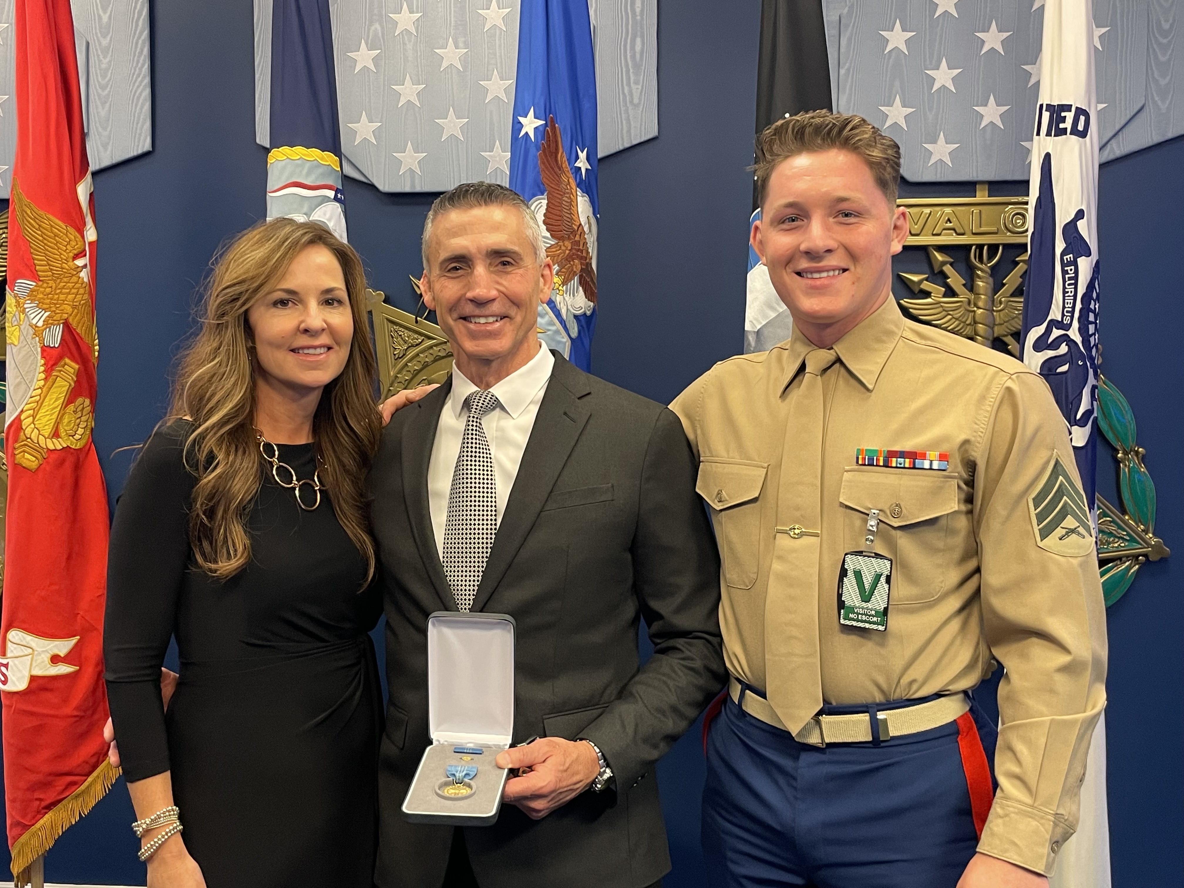 Samuel Hotz (center) pictured with his wife, Maryhelen Hotz (left), and son, Sgt. Grady Hotz (right) pictured