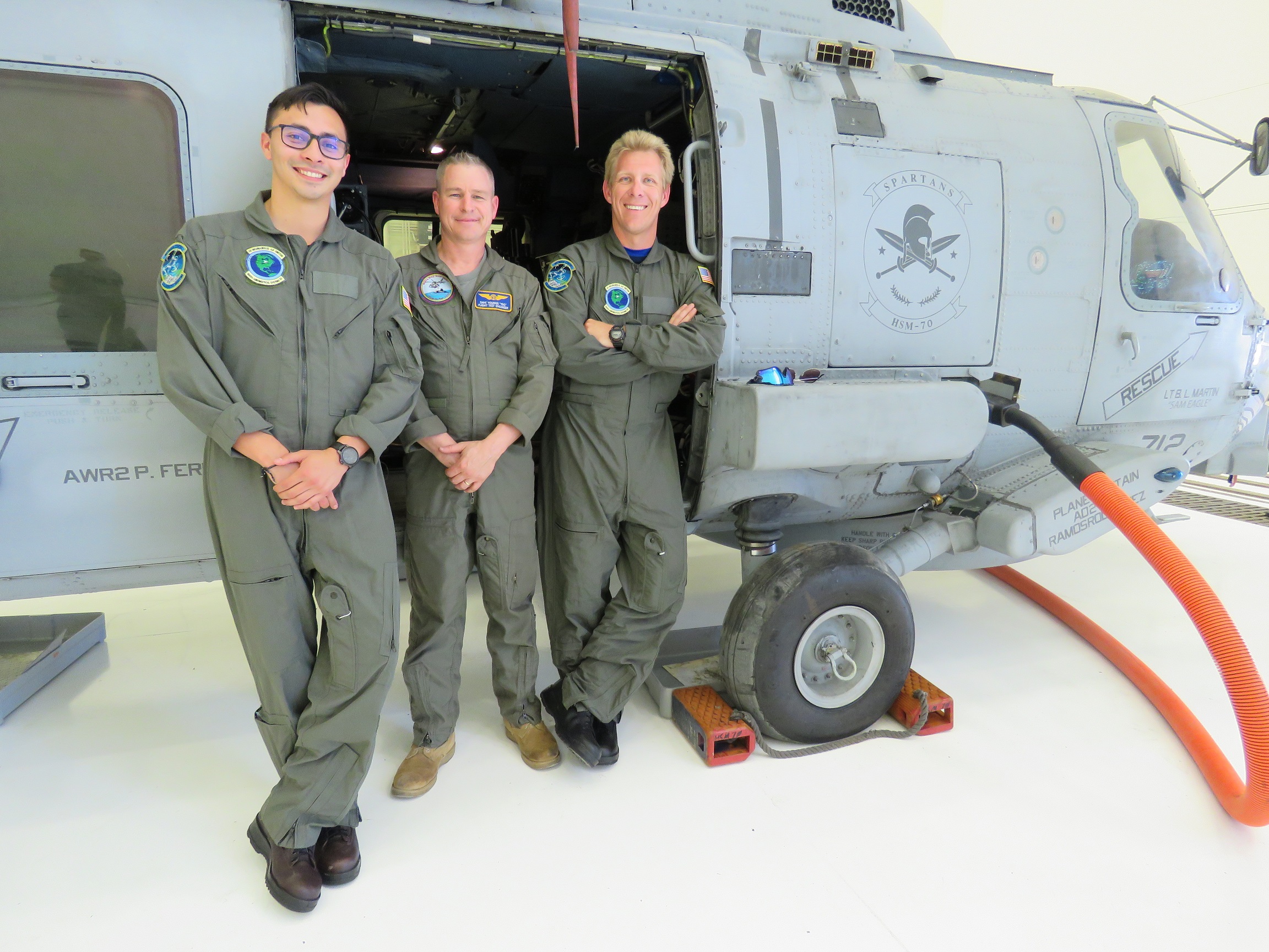 Jesus Ramos, left, and Thomas Hentges, right, pose with Dave Youngs, LockheedMartin flight test engineer, before their first flight to test SHAFTED hardware and software prototypes on the Atlantic Test Range in May. (Photo courtesy Brian Hill)