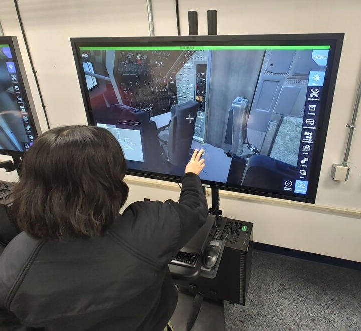Sailor in black shirt training on a virtual touch-screen