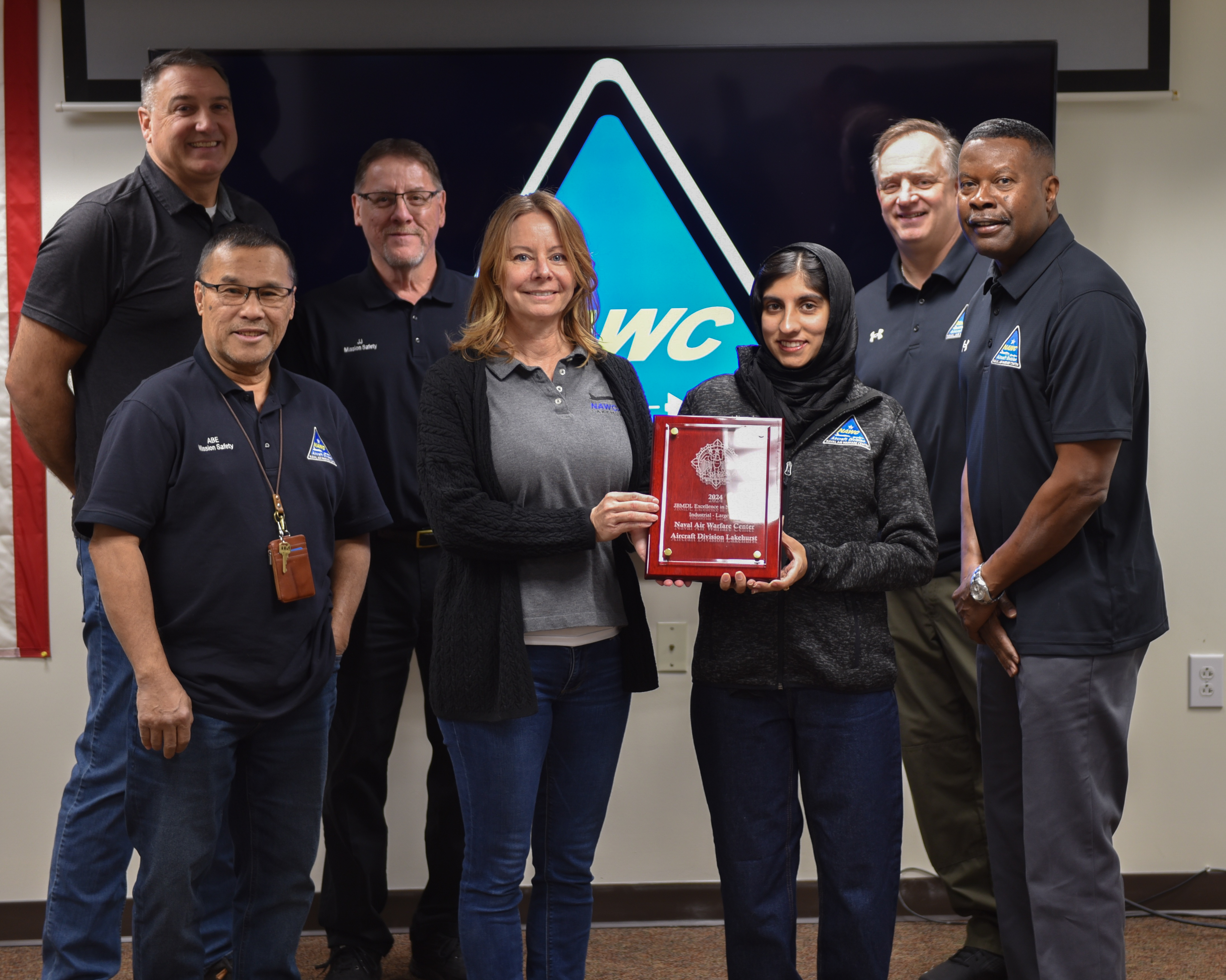 The Mission Safety Team stands with the Joint Base McGuire-Dix-Lakehurst Squadron Excellence in Safety Large Industrial Award