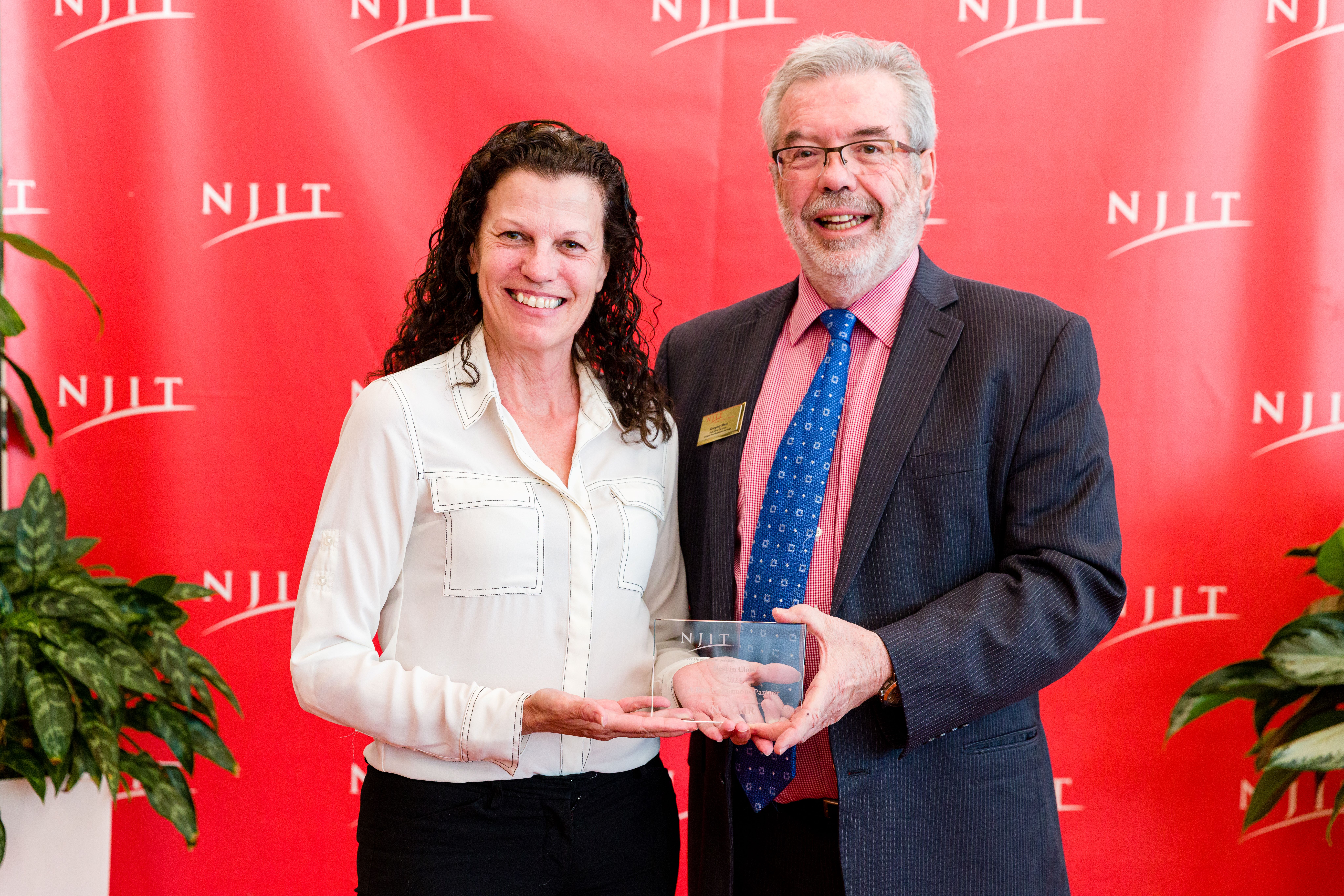 Michele Huk accepts NJIT "Best Continuous Partner Award” for NAWCAD Lakehurst