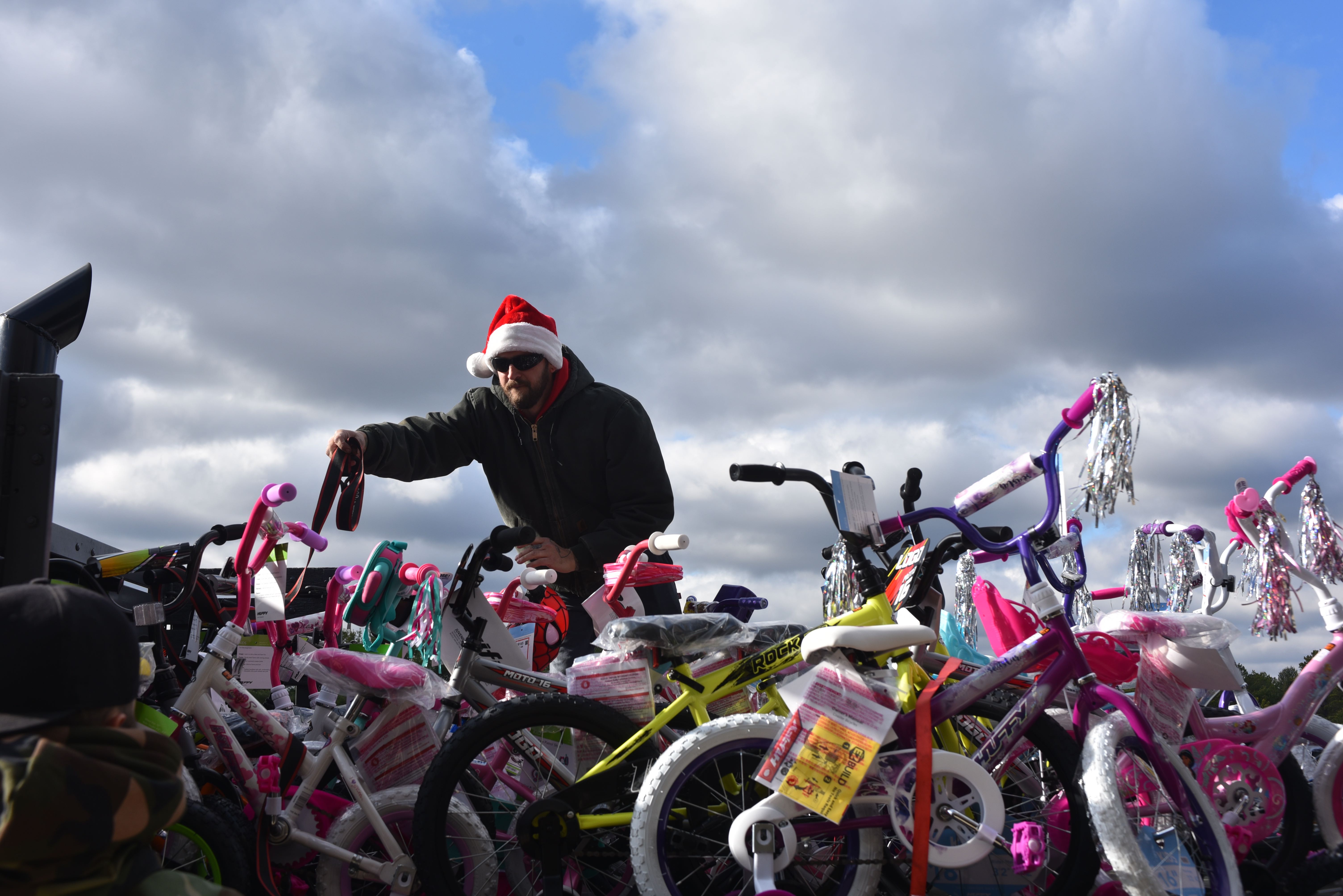 Volunteer delivers bikes for toys for tots