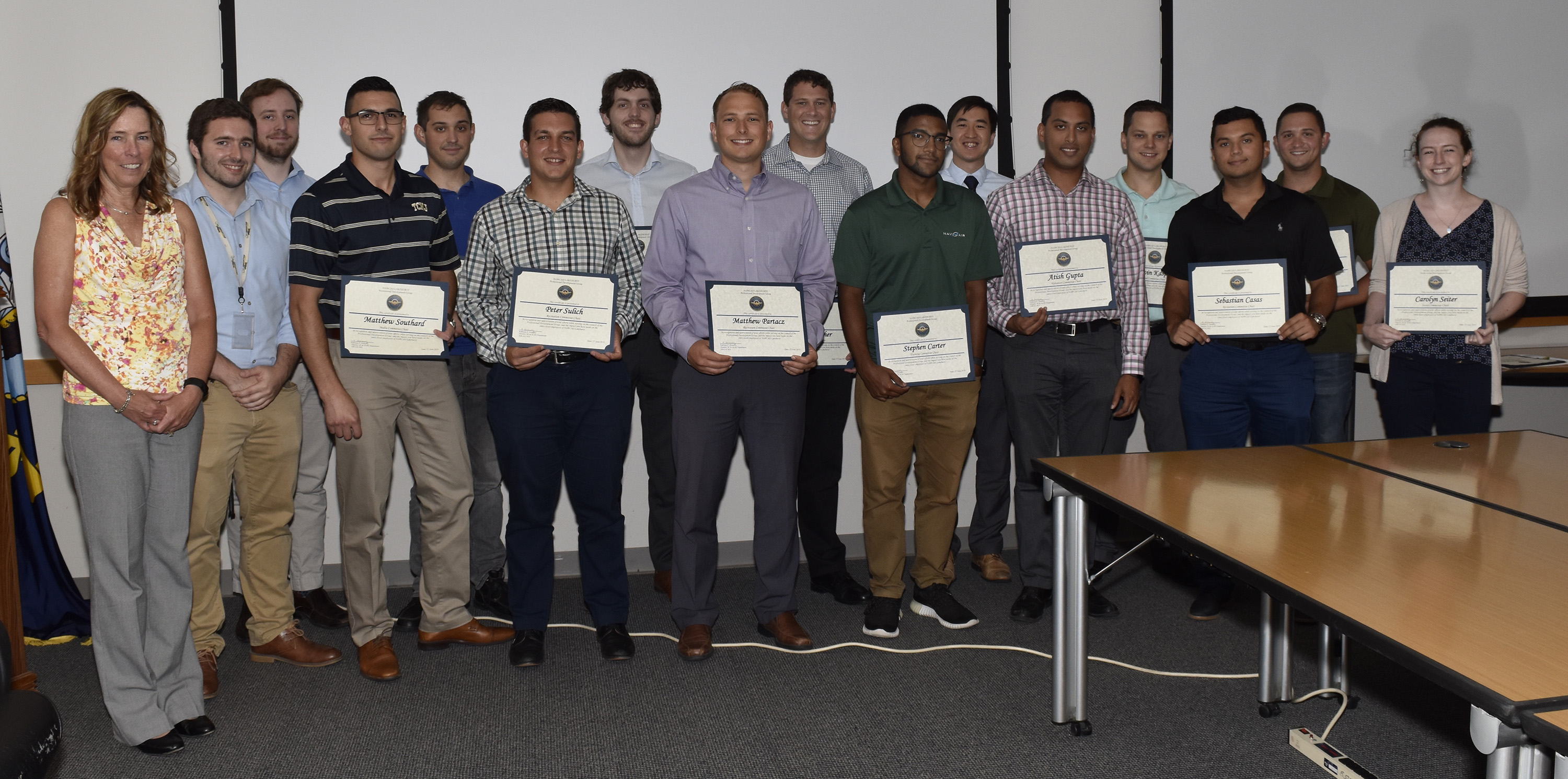 The Professional Develop Group poses for a group photo with award certificates
