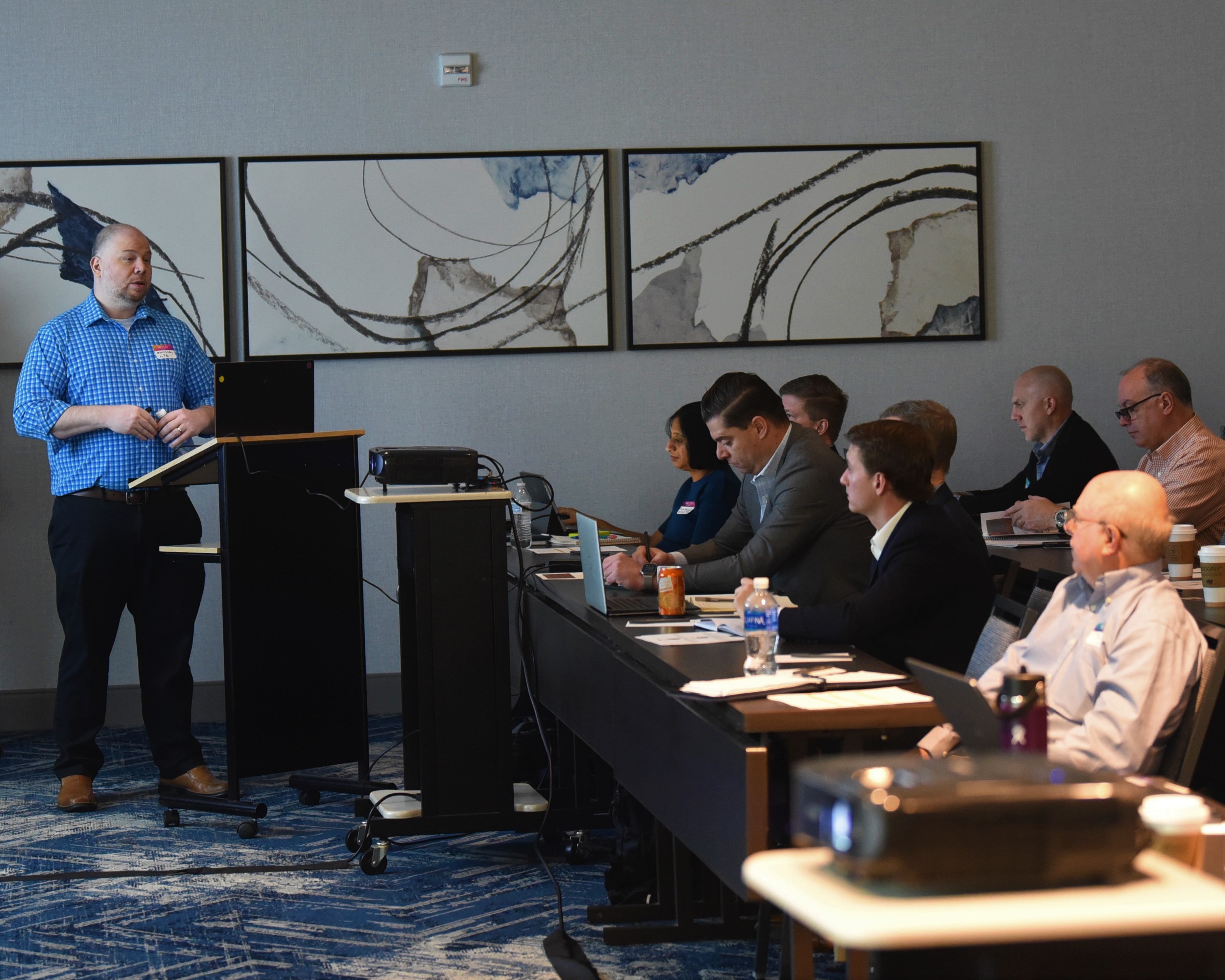 NAWCAD Lakehurst employee Kevin Larkins speaks during a meeting on shipboard robotics in Philadelphia