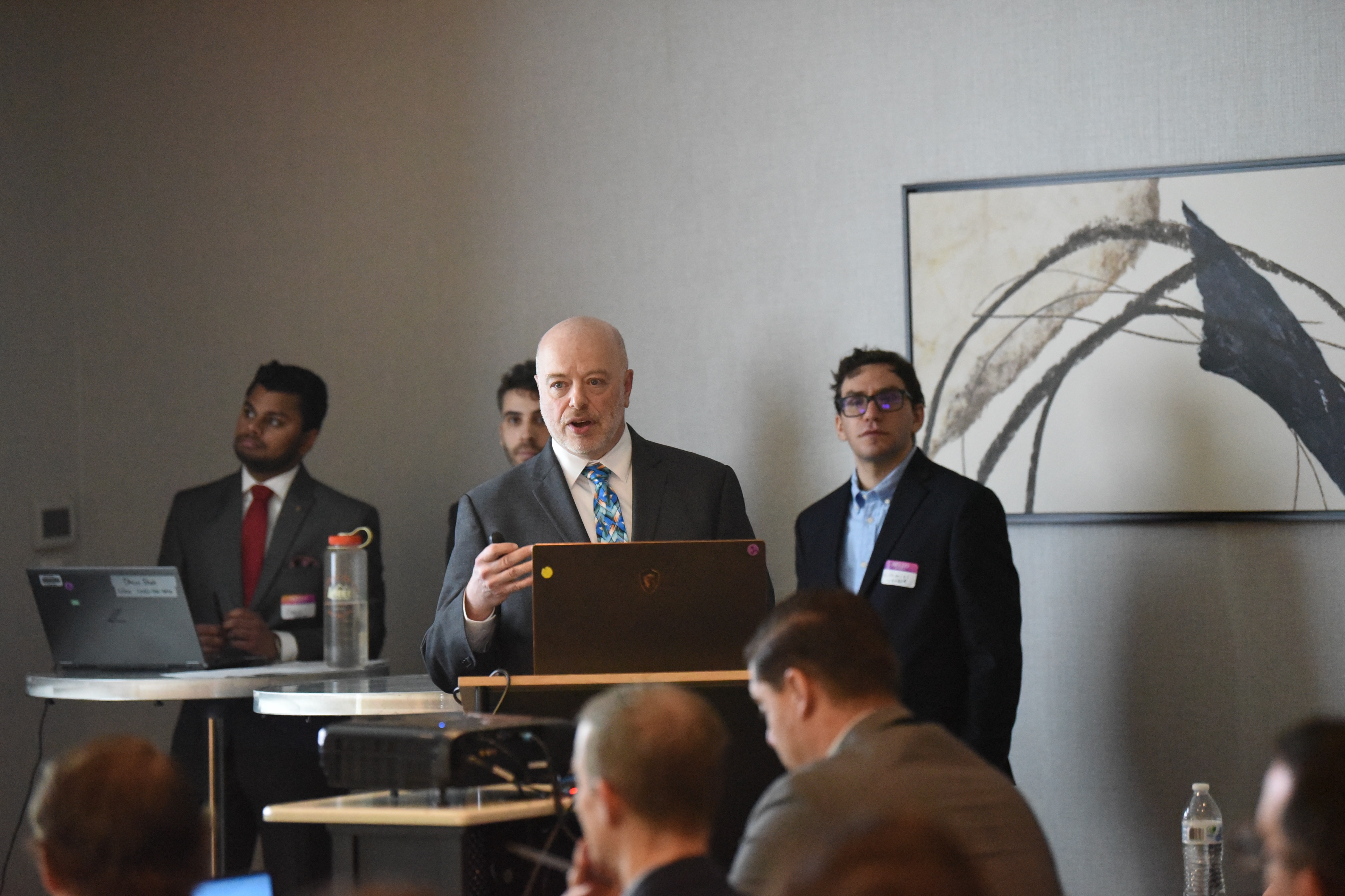 Mark Husni from Naval Air Warfare Center Aircraft Division Lakehurst speaks during a meeting on Shipboard Robotics