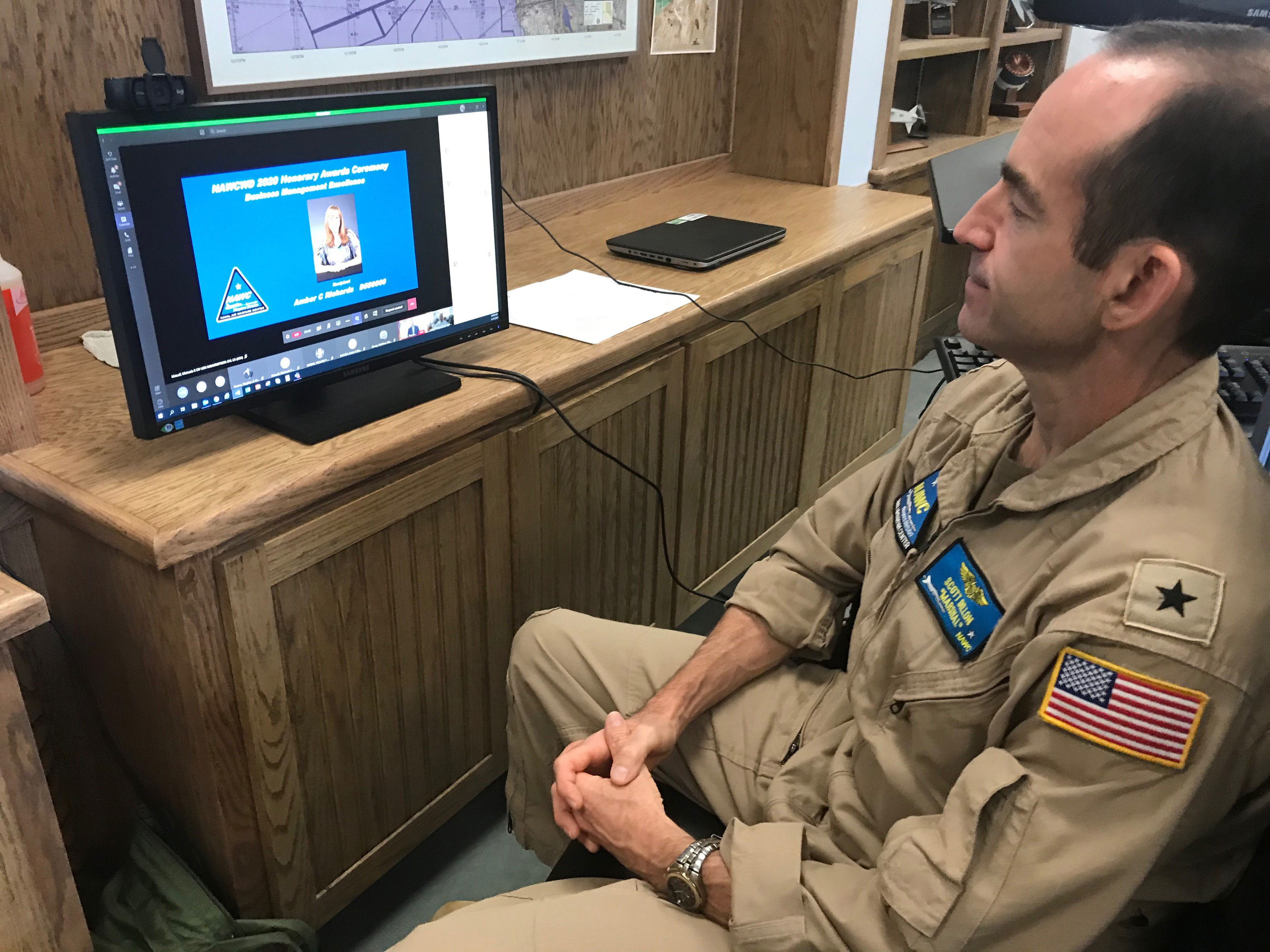 Rear Adm. Scott Dillon listens to an award citation during the NAWCWD Honorary Awards on Aug. 18. Because of COVID-19 constraints, this year’s ceremony was held virtually. (U.S. Navy photo by Renee Hatcher)