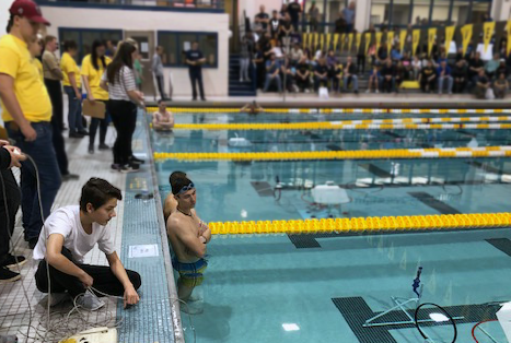 Students operate underwater robots in the Rowan University pool