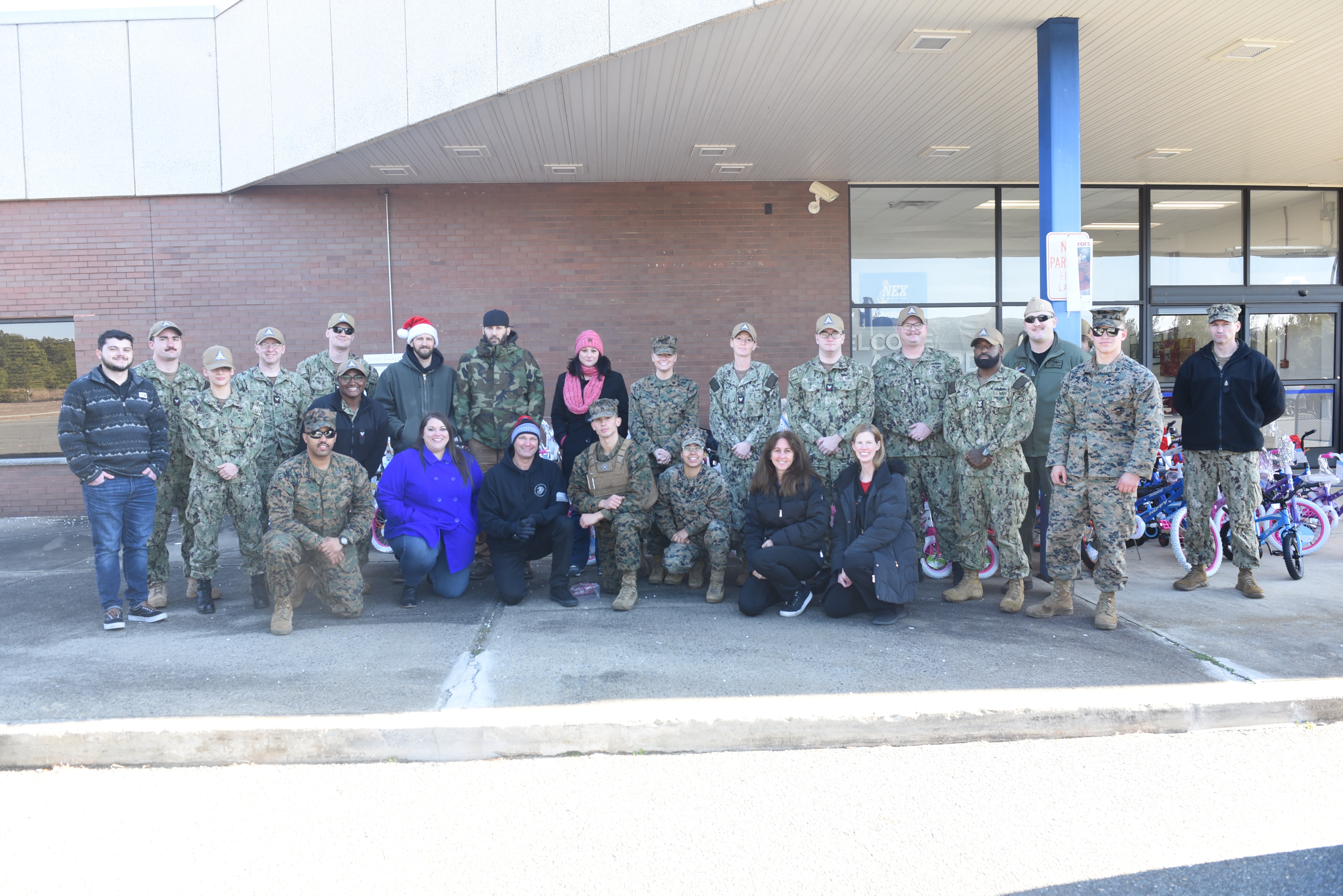 Volunteers and Sailors from Naval Air Warfare System Aircraft Division Lakehurst collected close to 1,000 toys and 60 toys for the annual Toys for Tots drive.