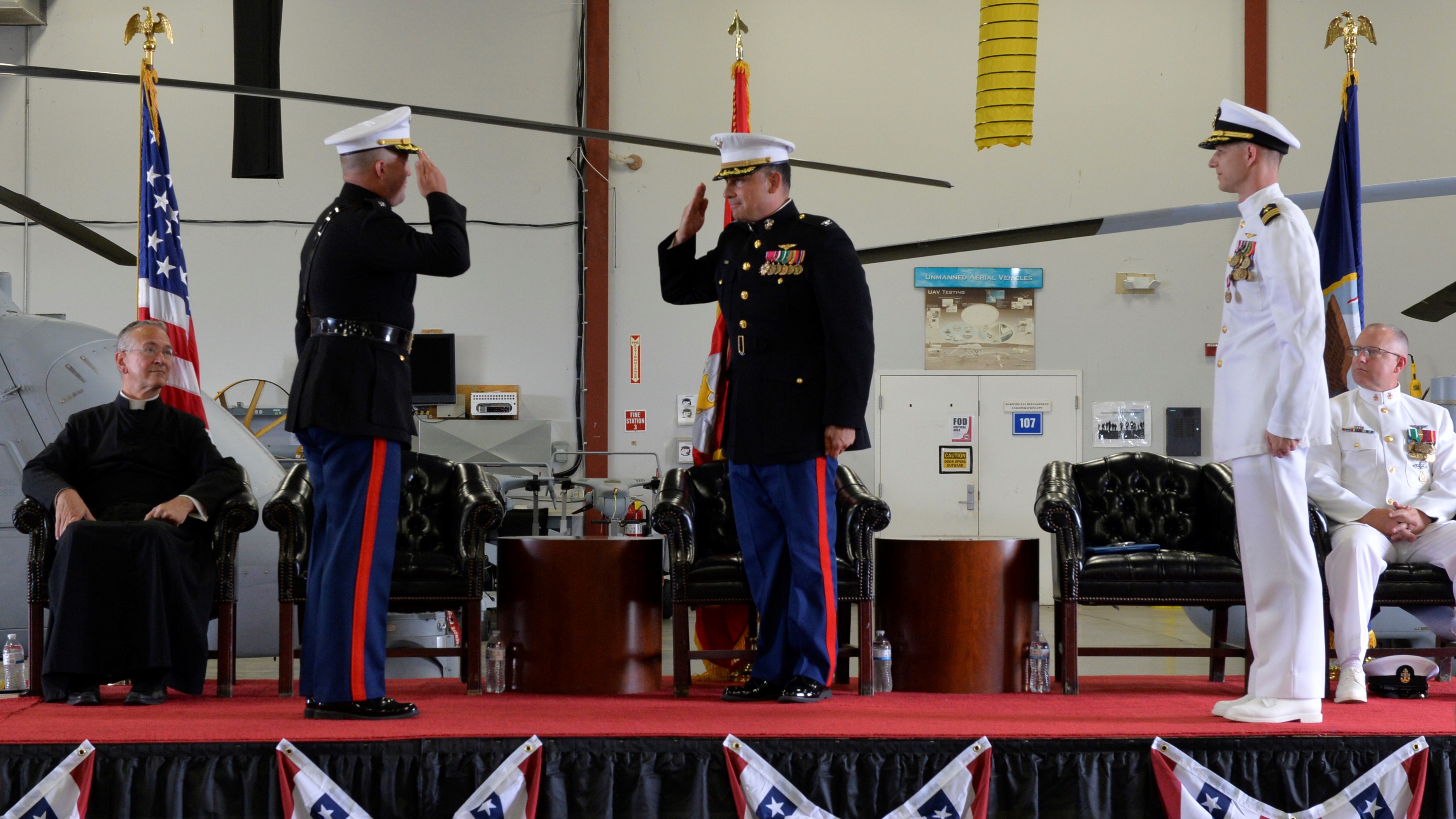 Lt. Col. Gary Shill salutes Naval Test Wing Atlantic Commodore, Col. Richard Marigliano