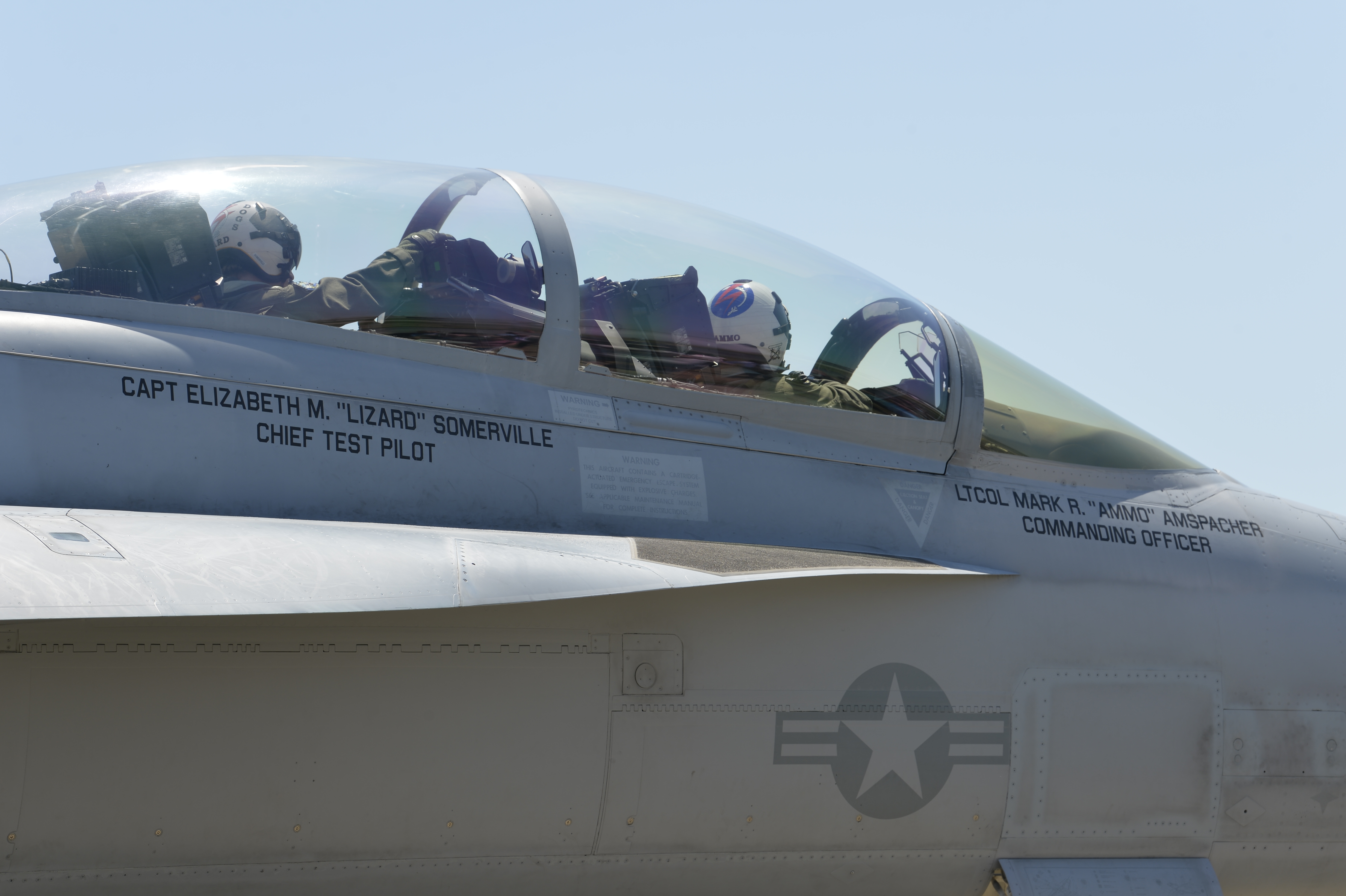Capt. Elizabeth Somerville flies with Lt. Col. Mark Amspacher during an airborne change of command ceremony