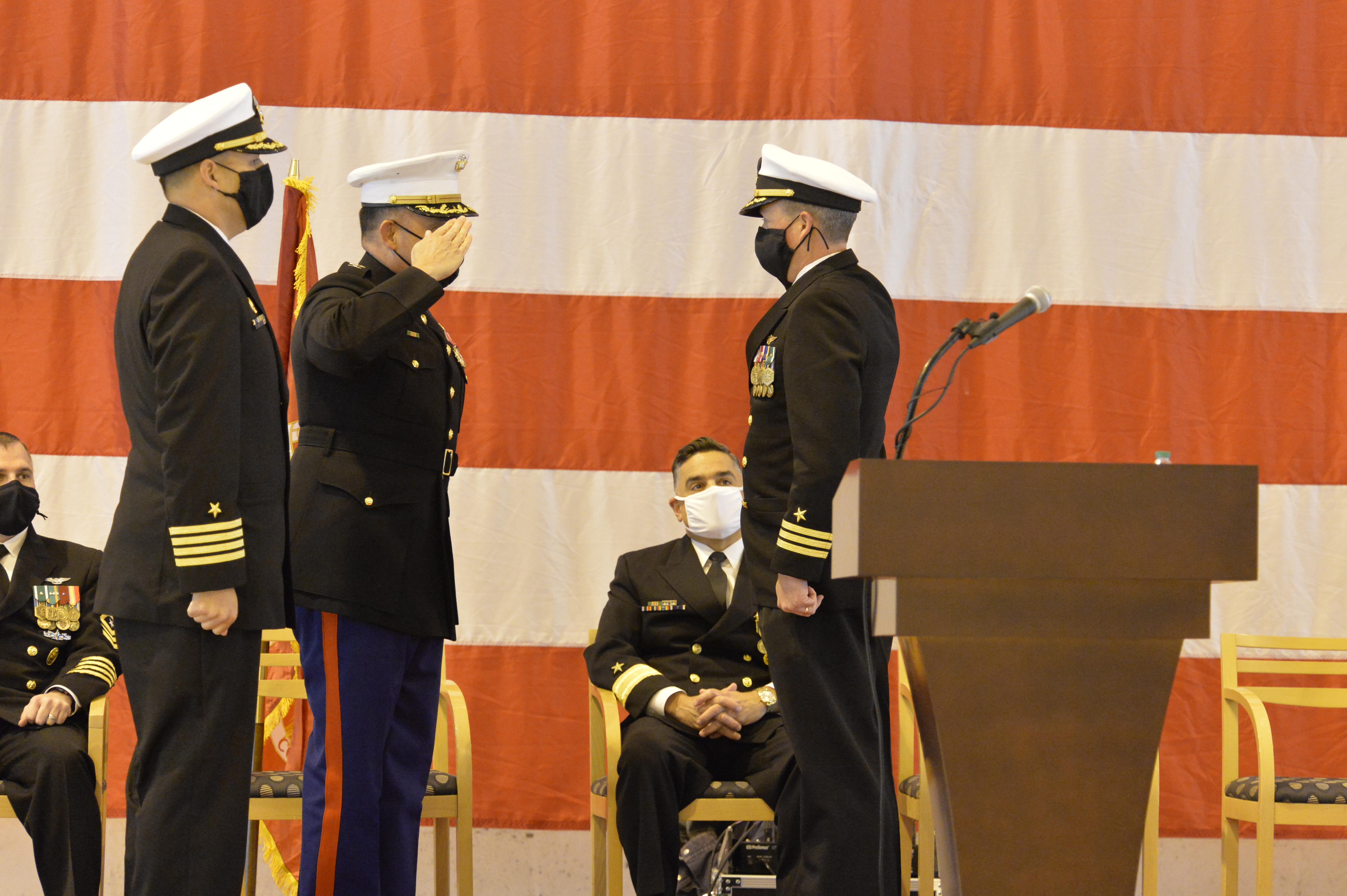 An incoming commanding officer salutes during a change of command ceremony.
