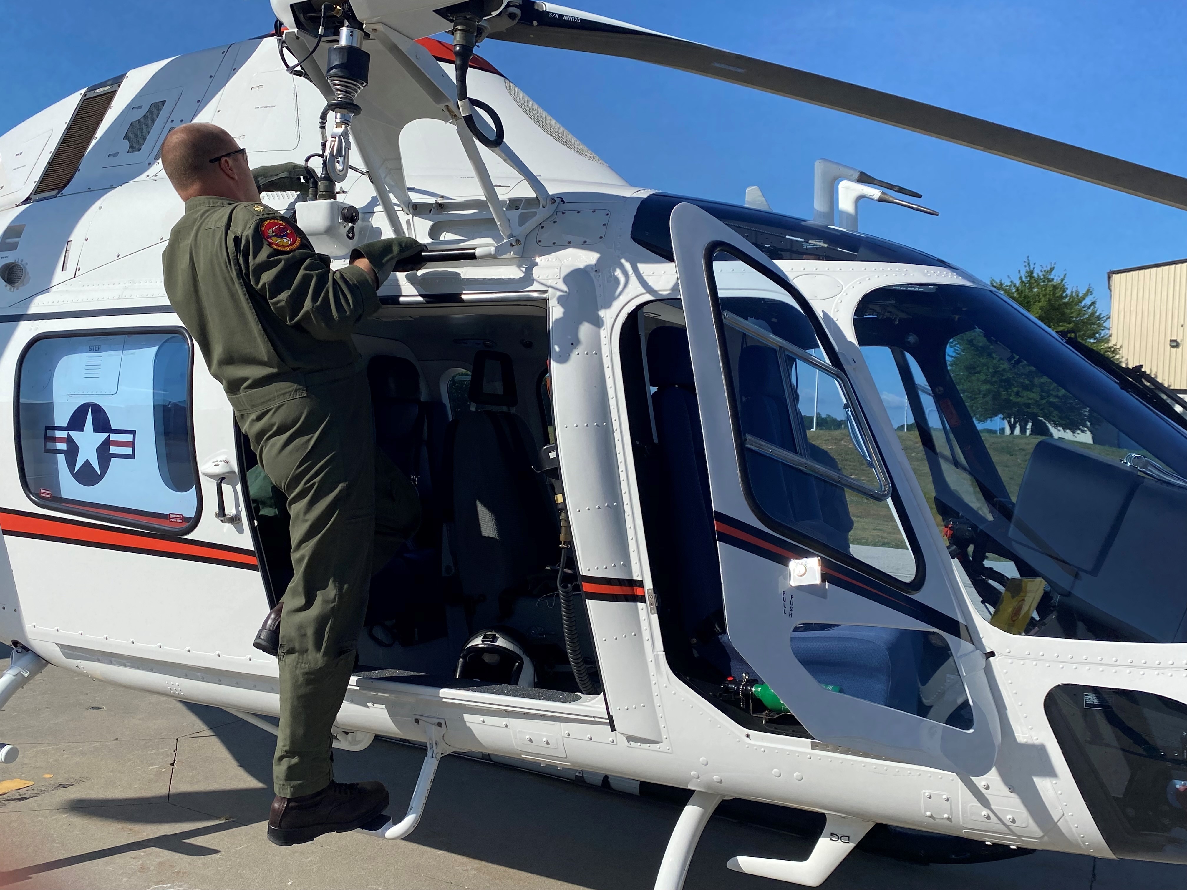 Instructor pilot conducts pre-flight check on TH-73A