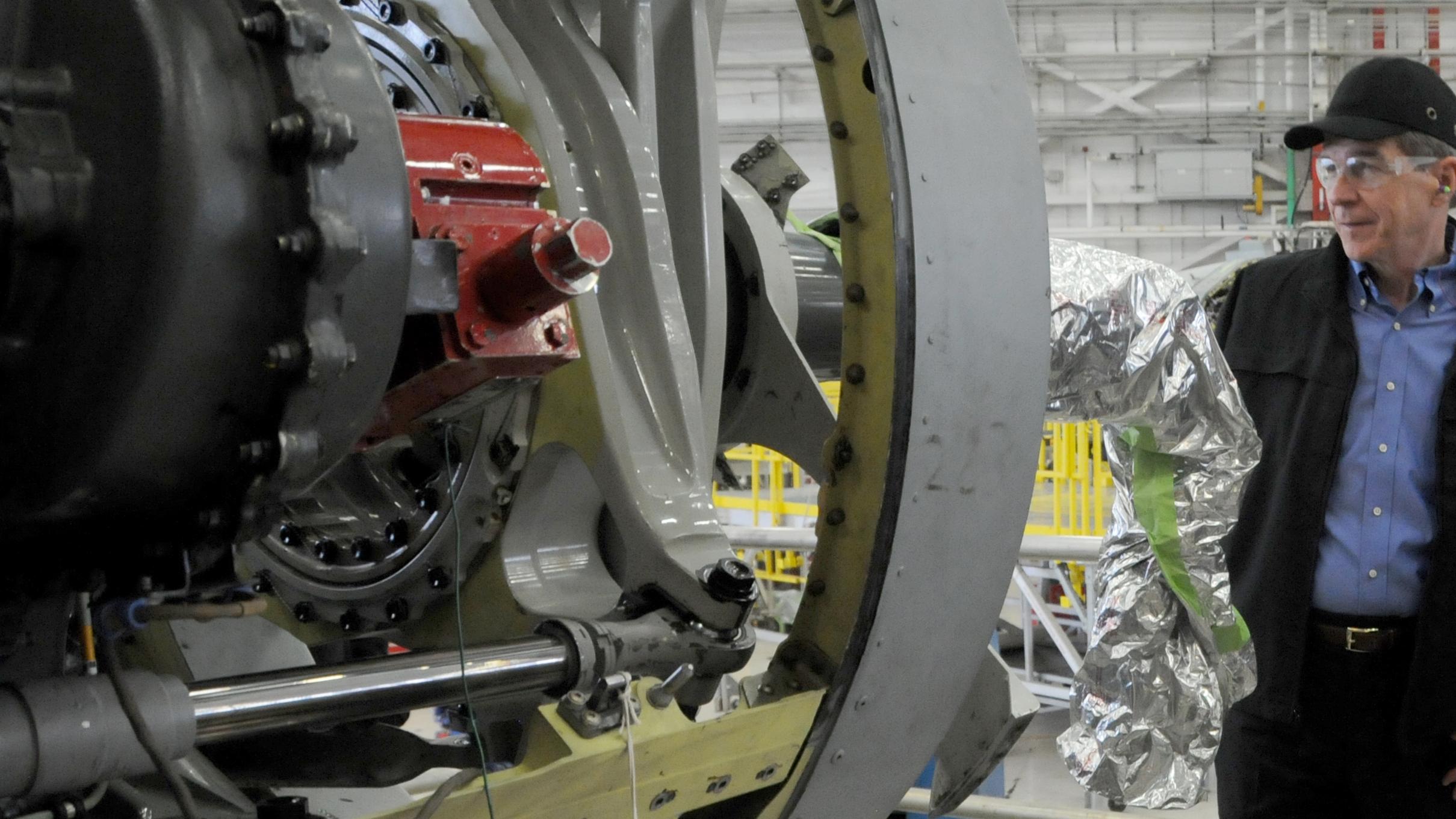 North Carolina Governor Roy Cooper views a V-22 nacelle with FRCE artisans