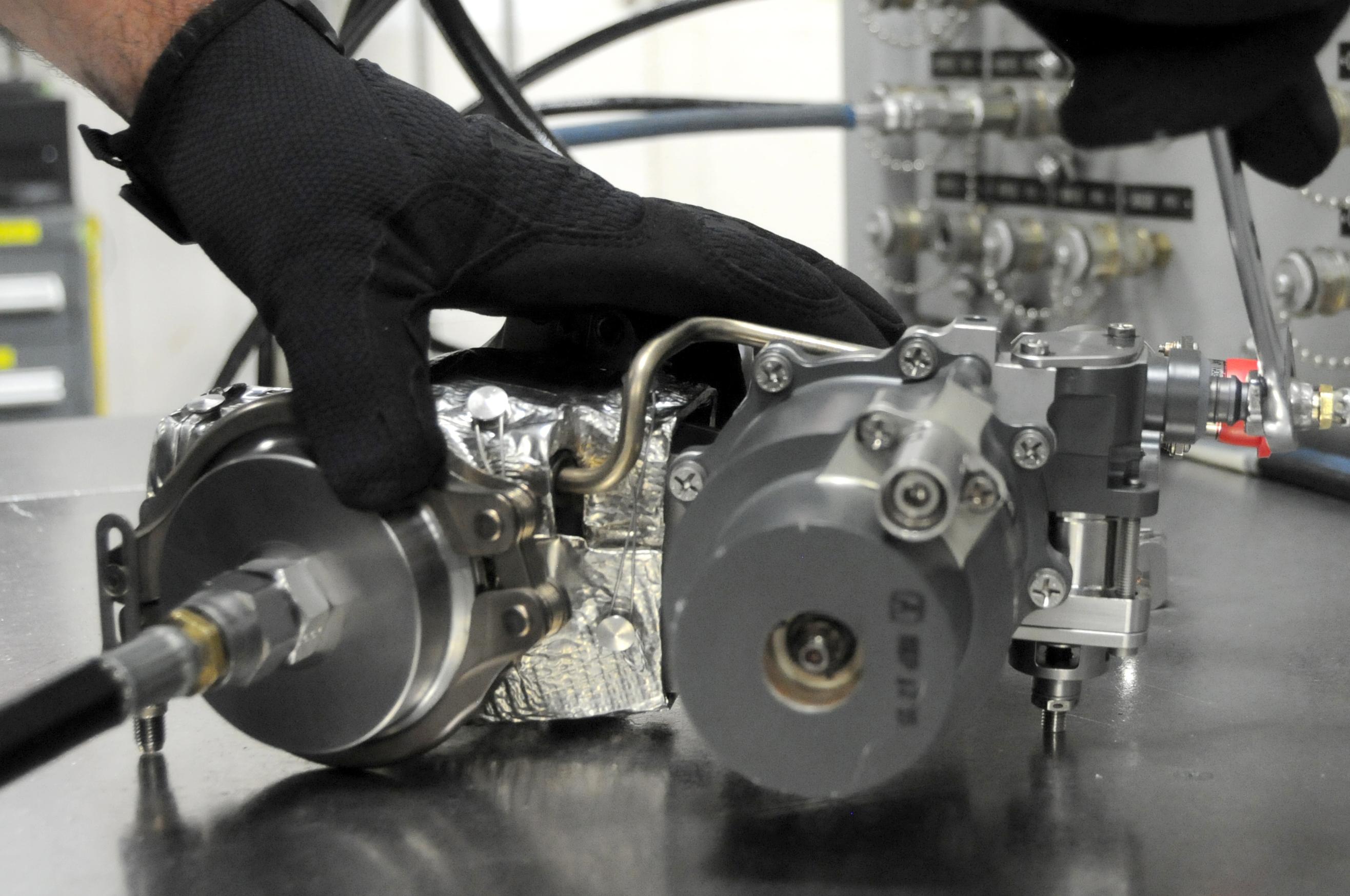 Man readies F-35 valve for testing