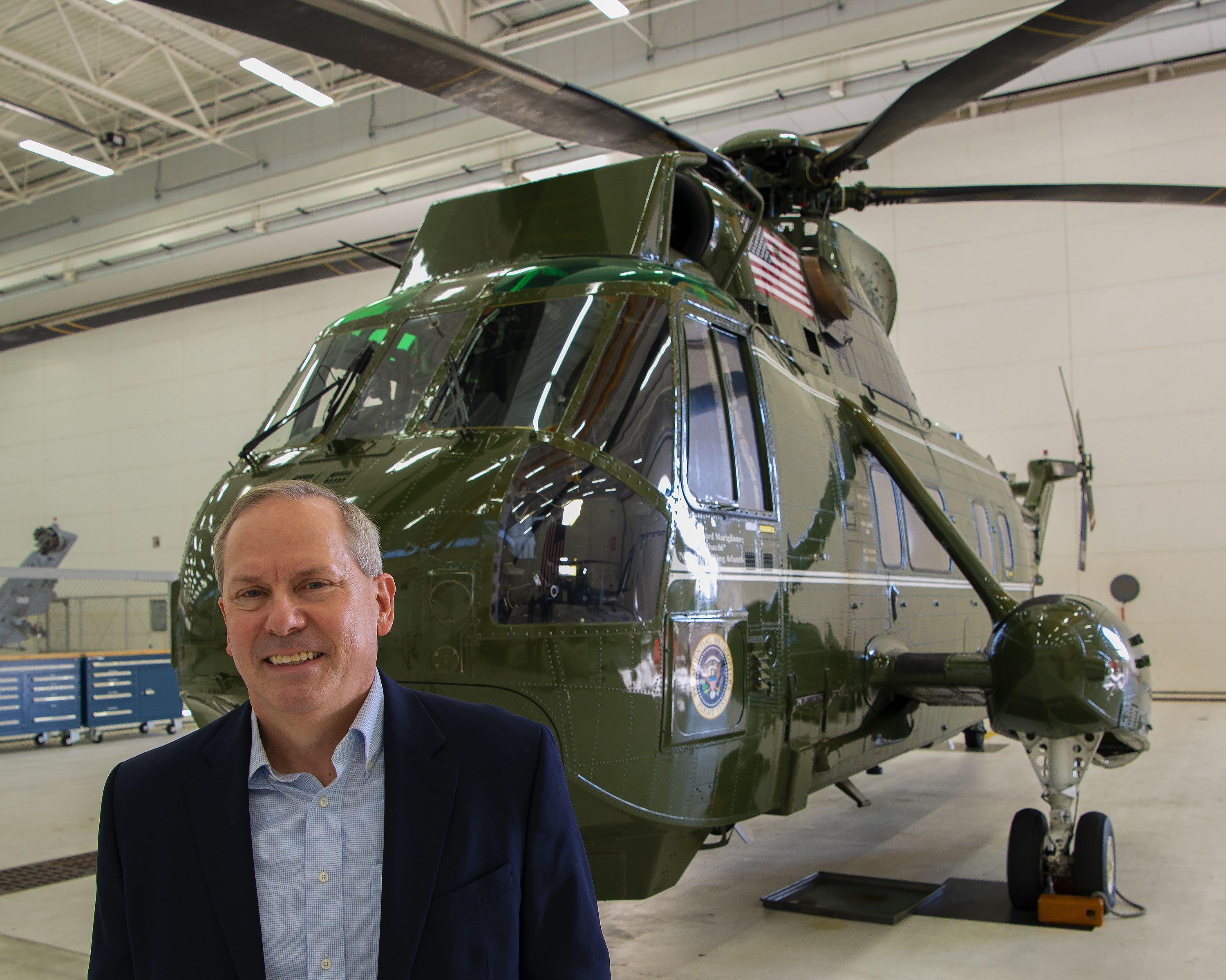 Glenn Perryman, deputy program executive officer for Air Anti-Submarine Warfare, Assault, and Special Mission Programs, stands in front of Sikorsky NVH-3A Sea King BuNo 150614, which his father flew as commanding officer of Marine Helicopter Squadron (HMX) 1. The helicopter subsequently served Air Test and Evaluation Squadron (HX) 21 as a testbed for 32 years before making its last flight in October 2020.