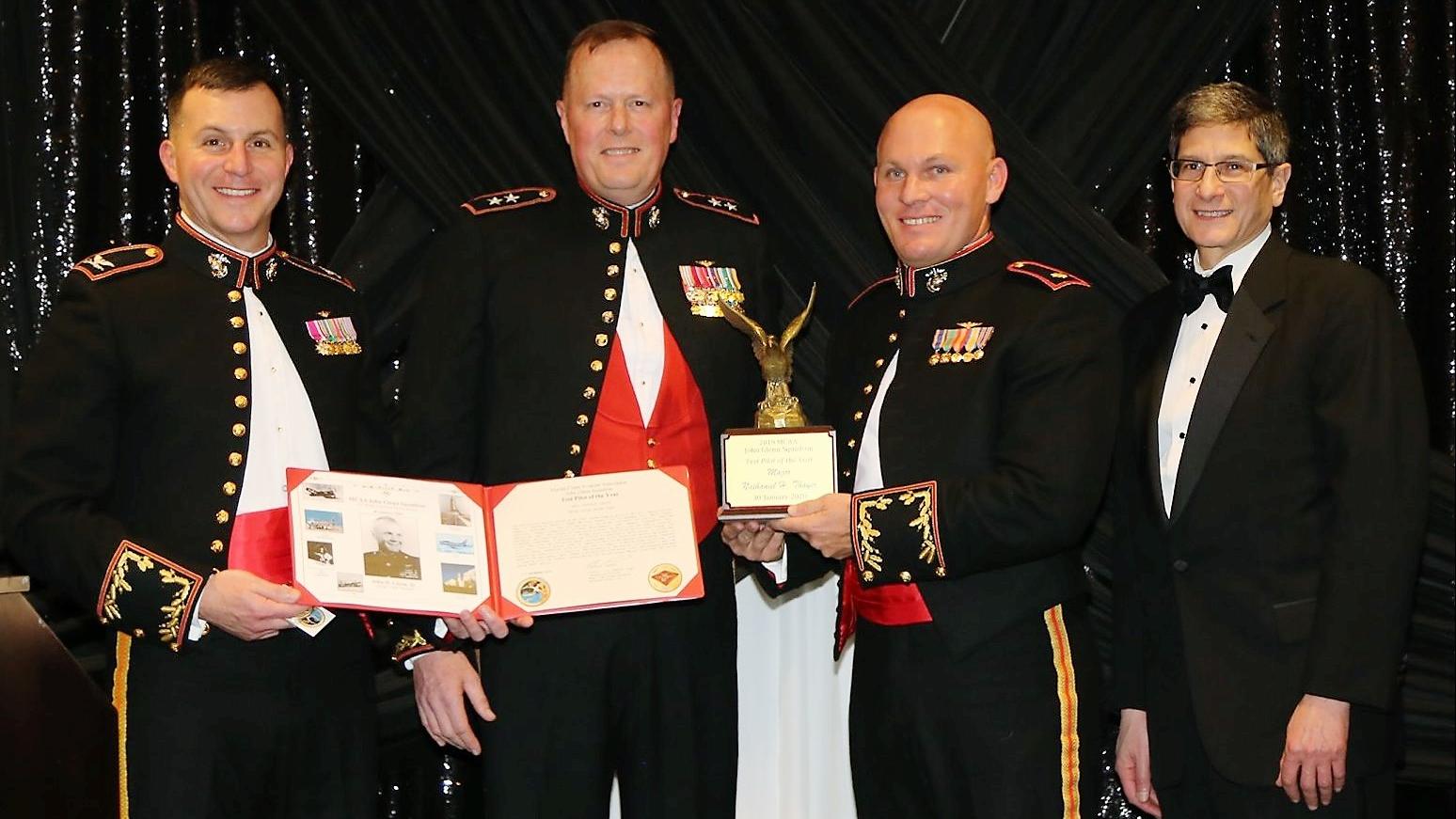 Maj. Nathaniel Thayer, second from right, AV-8B Joint Systems Support Activity military deputy, is honored as the Marine Corps Aviation Administration John Glenn Squadron Test Pilot of the Year by