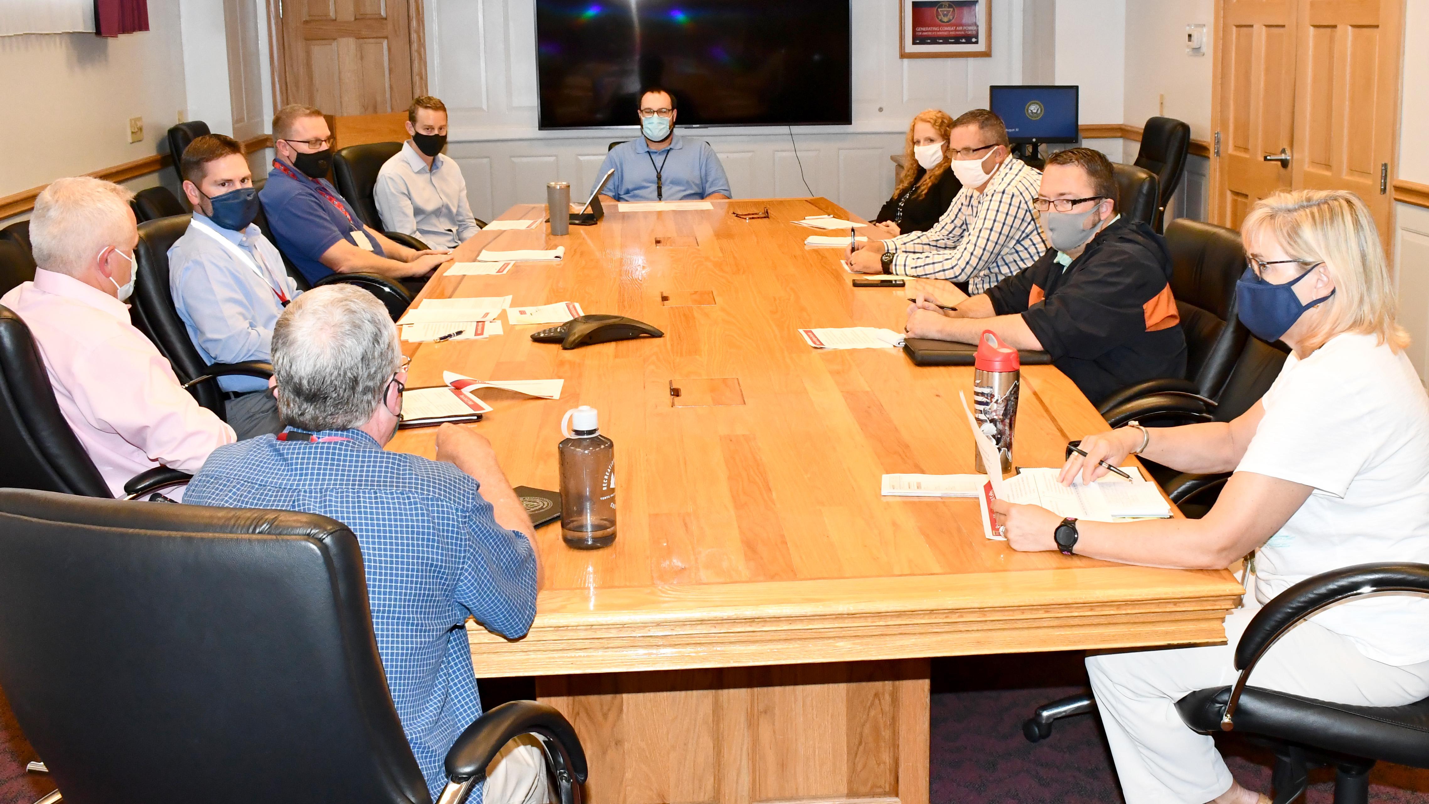 Group of FRCE leaders around table