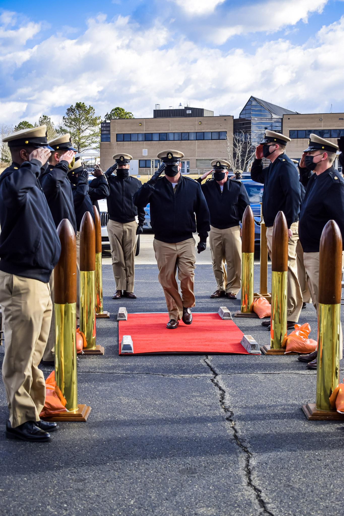 Chief Aviation Electronics Technician Stephen Paustian renders a hand salute following his advancement during a chief petty officer (CPO) pinning ceremony hosted by the U.S. Naval Test Pilot School at Naval Air Station Patuxent River on Jan. 29, 2021.