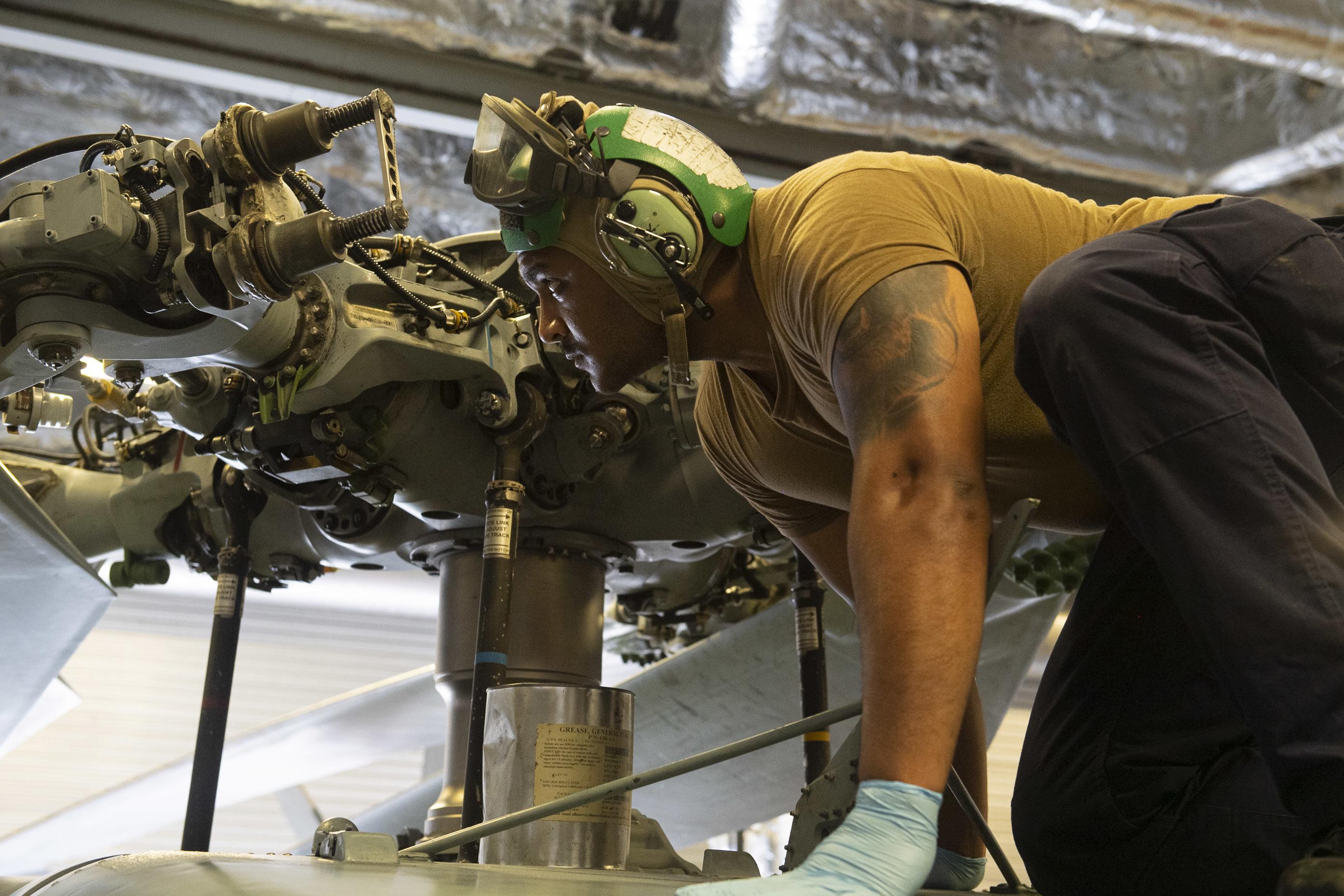Maintainer on a MH-60S Seahawk