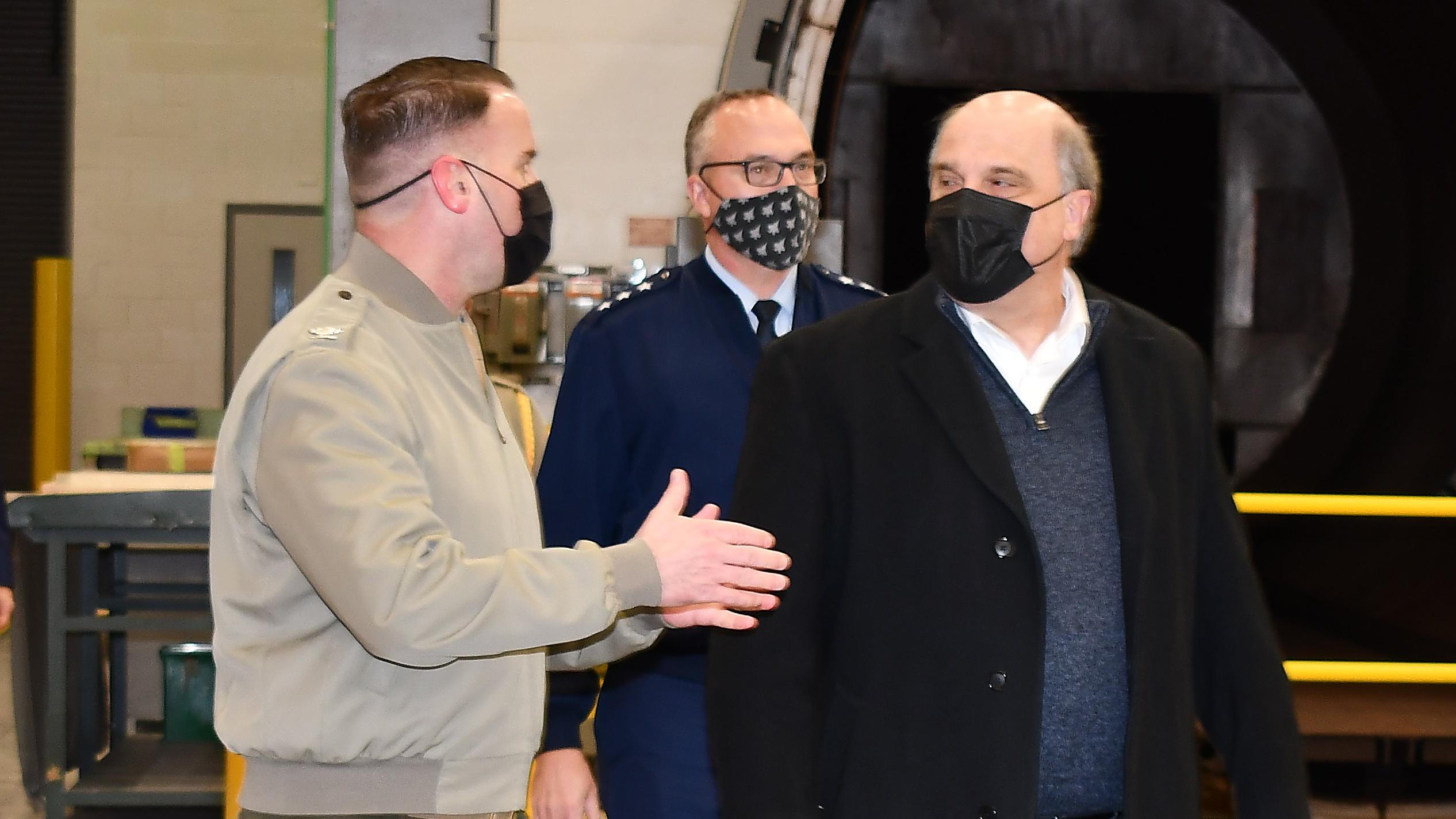 Fleet Readiness Center East (FRCE) Commanding Officer Col. Thomas A. Atkinson, left, discusses depot operations with Assistant Secretary of the Navy for Research, Development and Acquisition Frederick J. Stefany, right, and Program Executive Officer for the F-35 Lightning II Joint Program Office Lt. Gen. Erick Fick. 