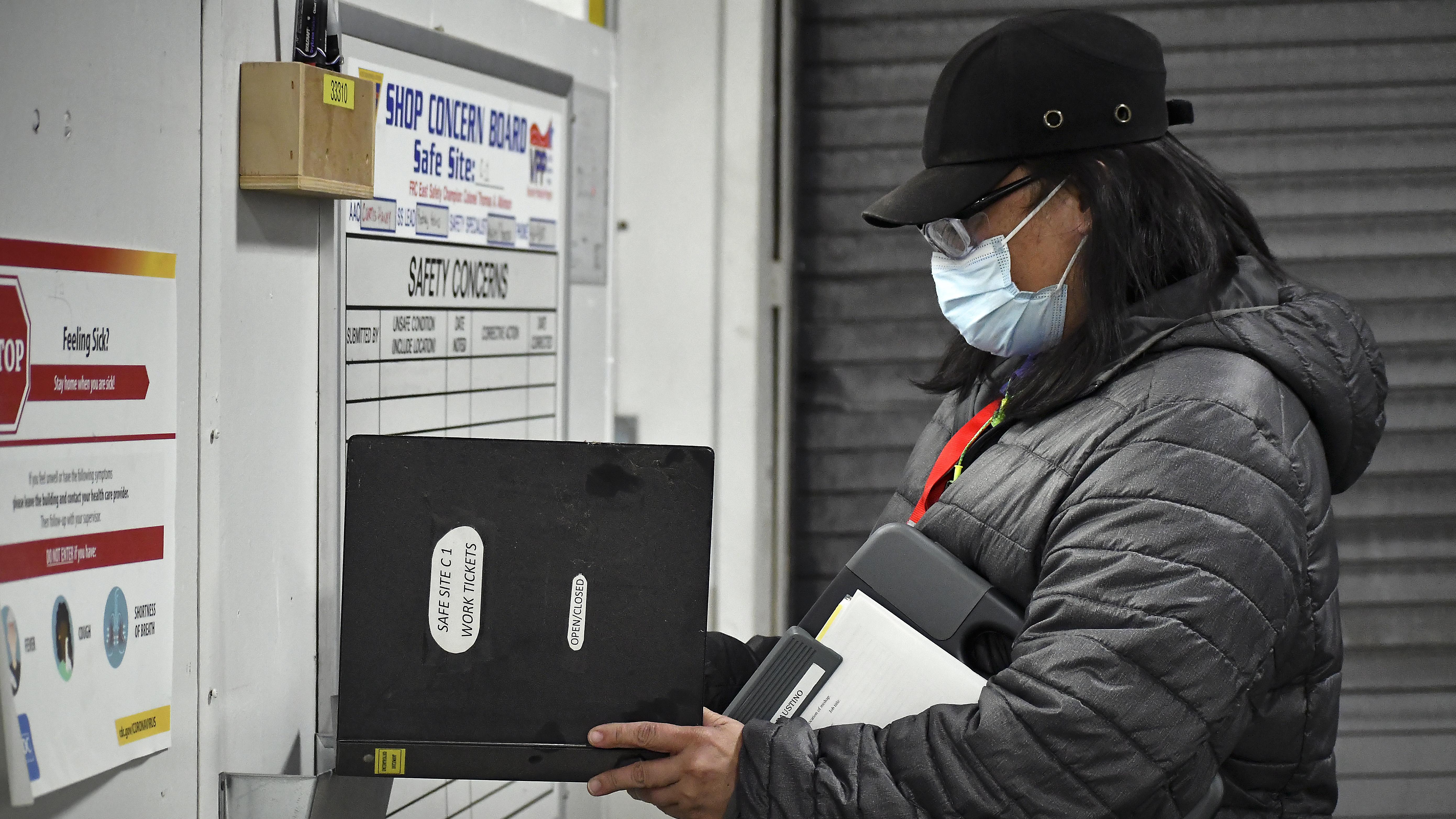 Aquiles Faustino, a safety specialist at Fleet Readiness Center East (FRCE), conducts an inspection of a safe site board. FRCE closed out calendar year 2021 with the lowest number of Occupational Safety and Health Administration (OSHA) recordable mishaps in the depot’s history.