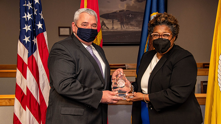 Deputy Assistant Secretary of Defense for Product Support Lisa P. Smith (right) presents Byrd with the 2021 Office of the Secretary of Defense for Acquisition and Sustainment PSM of the Year (Major Defense Acquisition Program, Acquisition Category 1) award. 
