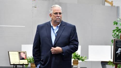 man in suit speaking