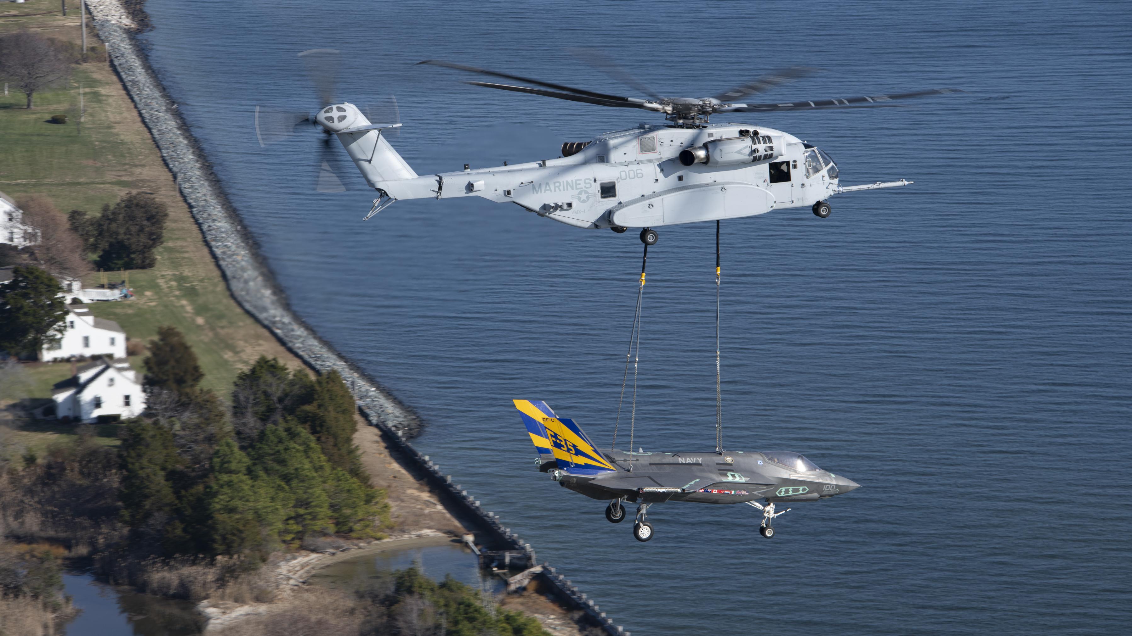 A non-flyable F-35C Lightning II airframe is flown as part of a CH-53K King Stallion external load certification lift Dec. 13, 2022, at Naval Air Station Patuxent River, Md.