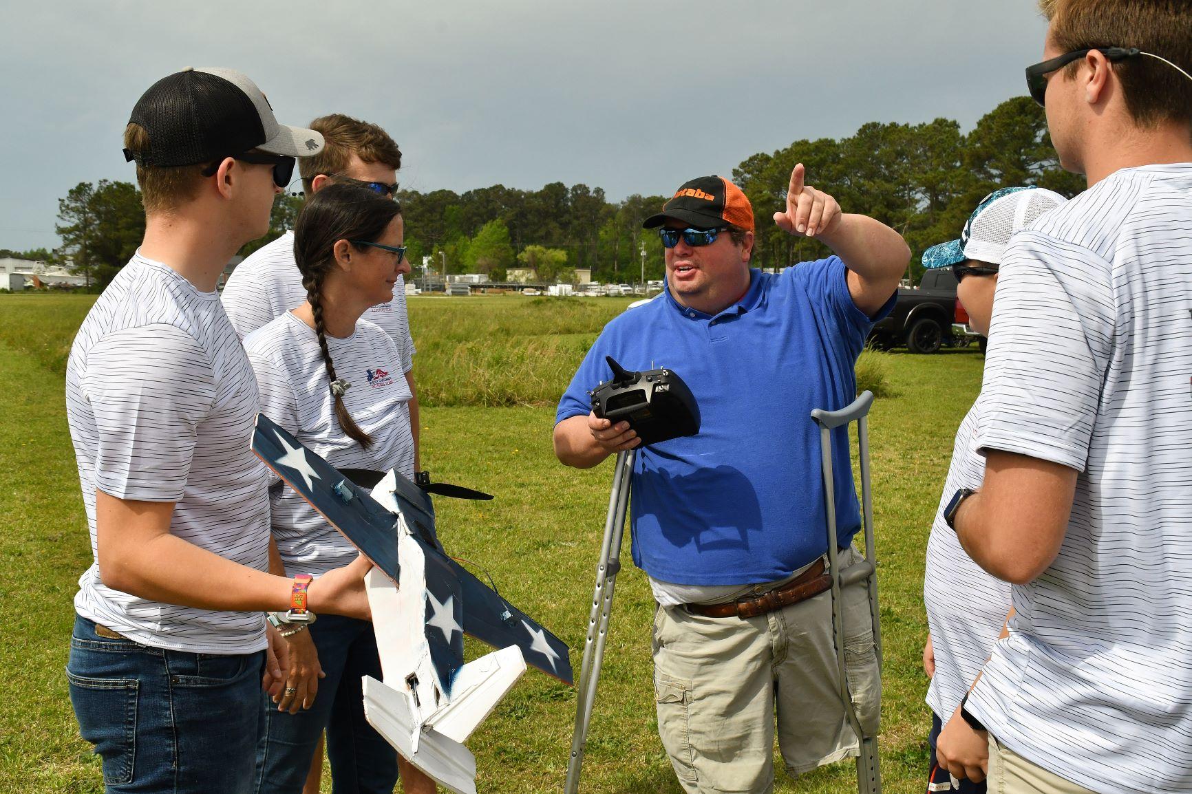 Elton Fairless, a senior engineer with Fleet Readiness Center East’s (FRCE) Unmanned Aerial Systems Fleet Support Team, prepares to test an unmanned aerial vehicle (UAV) designed by students from West Carteret High School during the 2023 Ultimate Unmanned Aerial Vehicle Competition held April 22 in Newport. Students representing eastern North Carolina high schools designed UAVs for the competition, which evaluated the speed and maneuverability of their creations. 