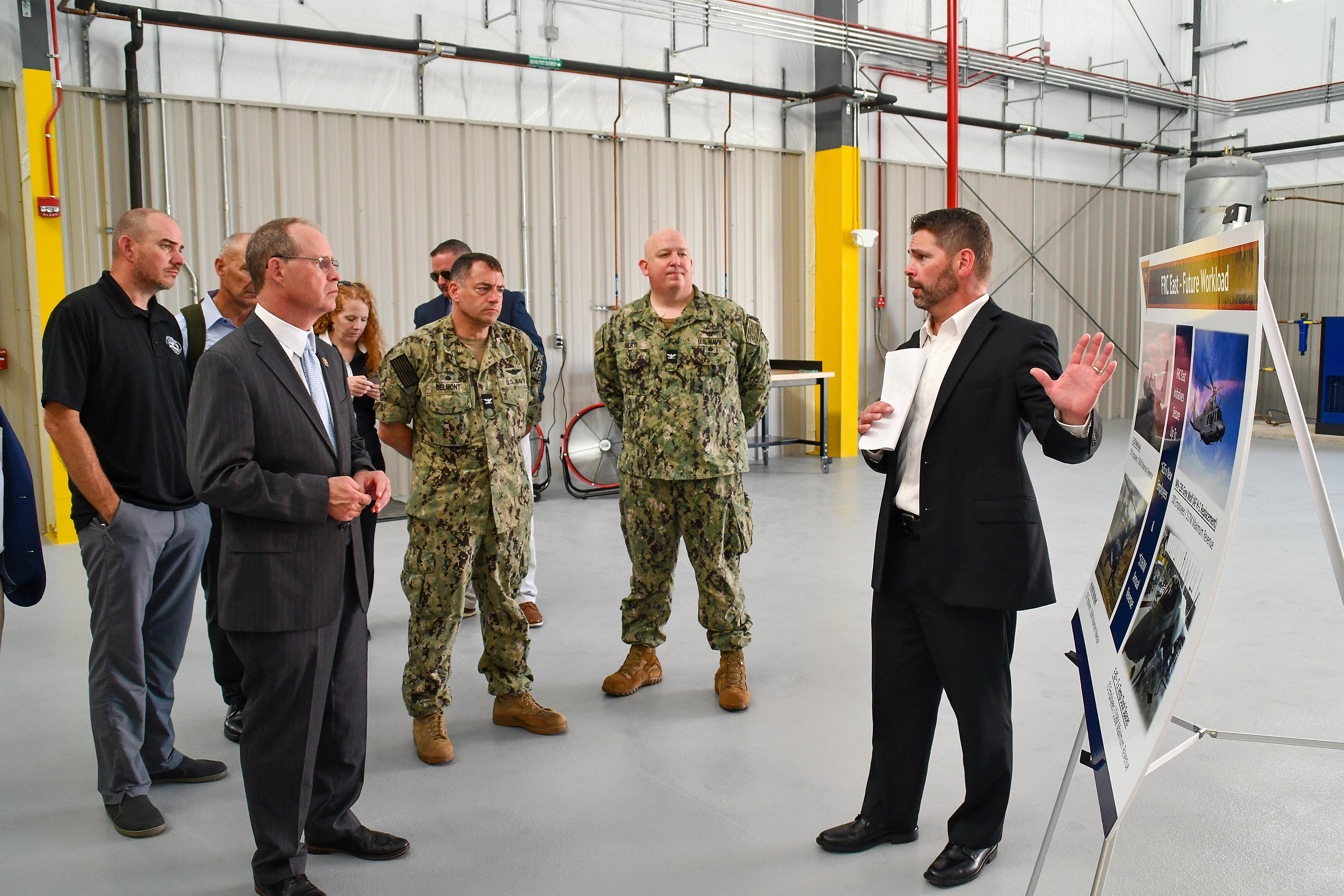 Fleet Readiness Center East (FRCE) Business Development and Workload Planning Branch Head Matt McCann, right, briefs U.S. Rep. Greg Murphy on the depot’s future F-35 vertical lift fan testing and processing facilities during Murphy’s visit to the facility Aug. 14. 