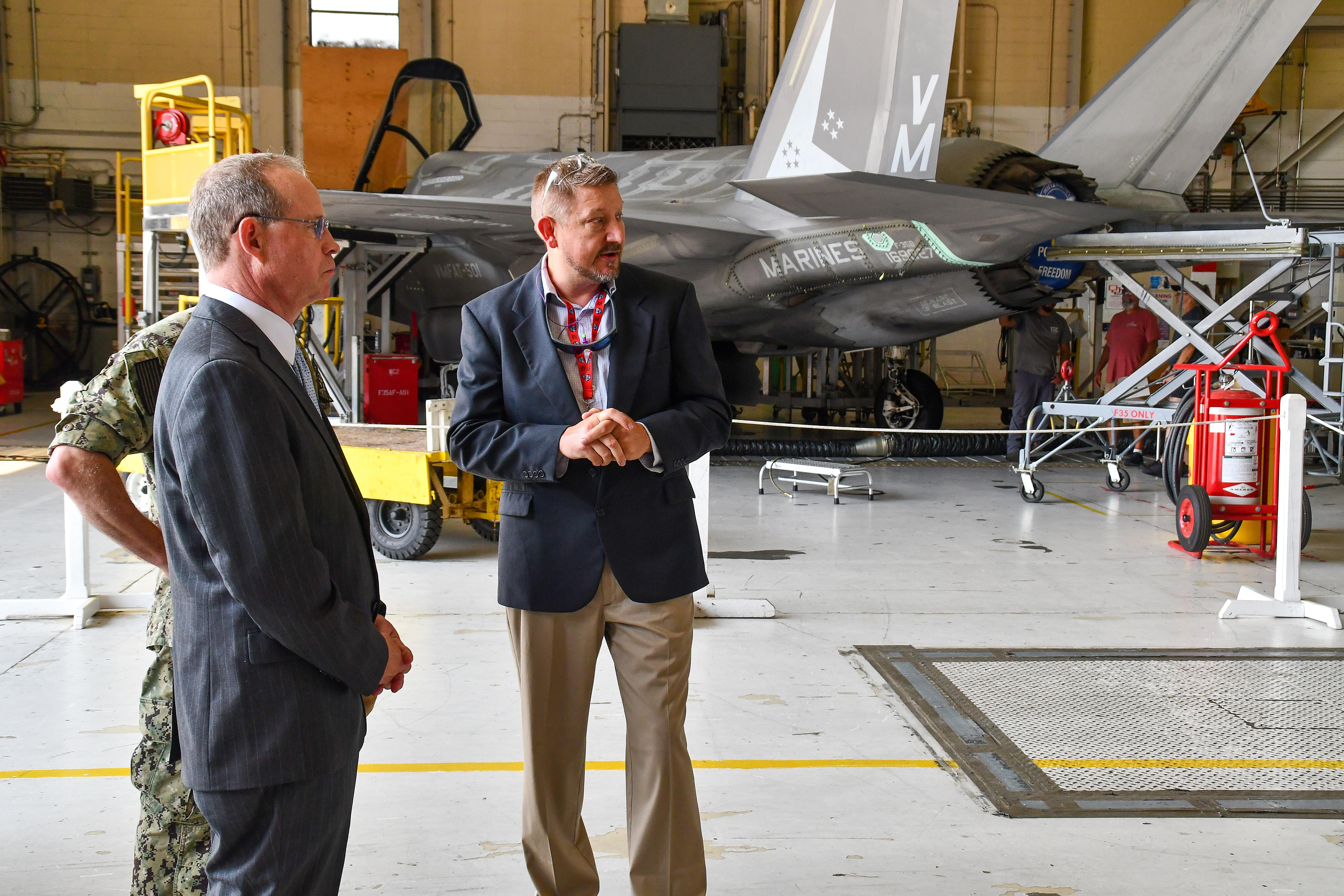 Fleet Readiness Center East (FRCE) F-35 Branch Head Ike Rettenmair, right, and U.S. Rep. Greg Murphy discuss FRCE's support of the F-35B Lightning II during Murphy’s visit to the facility Aug. 14. 