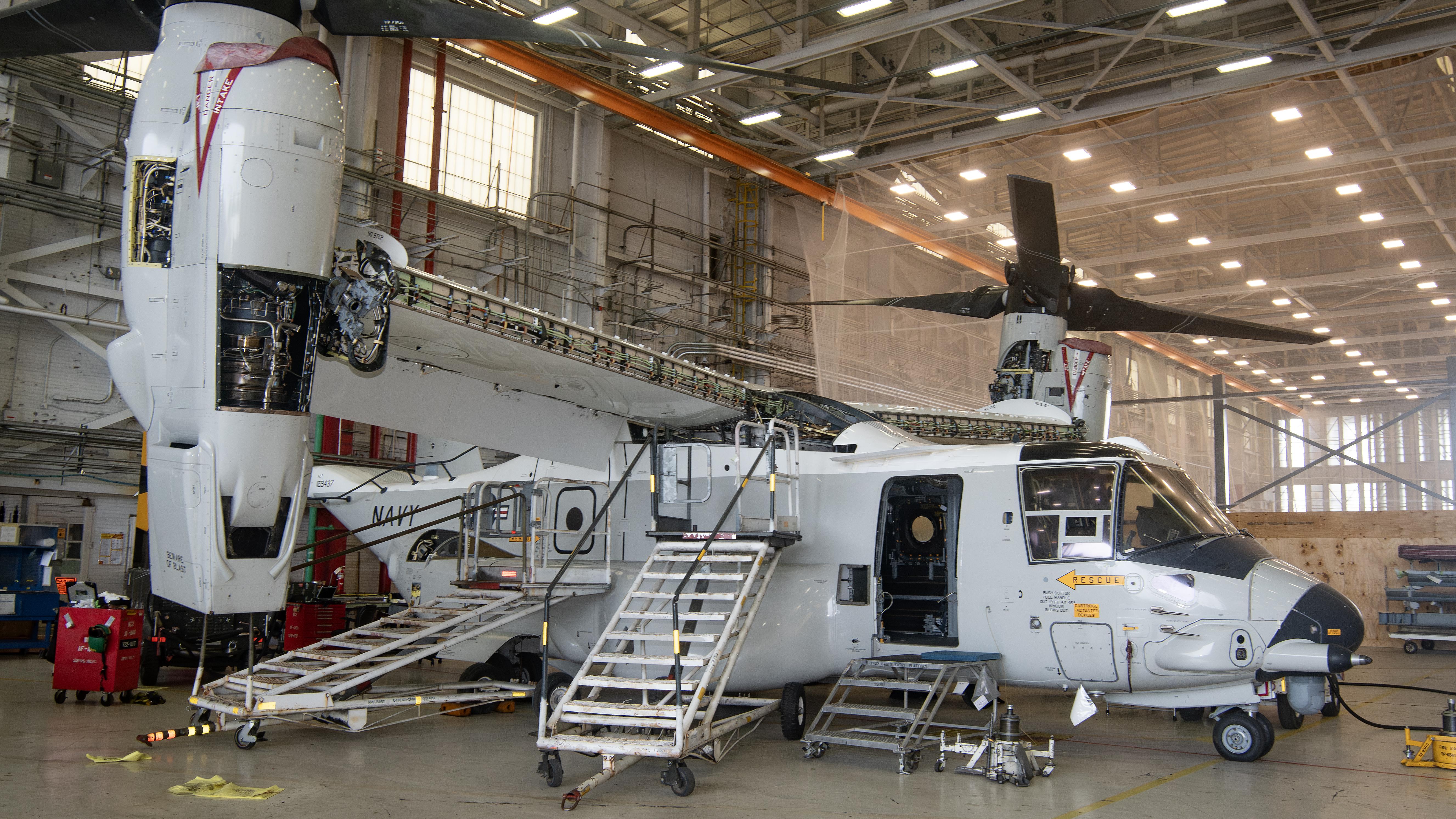 Navy CMV-22B aircraft in maintenance hangar