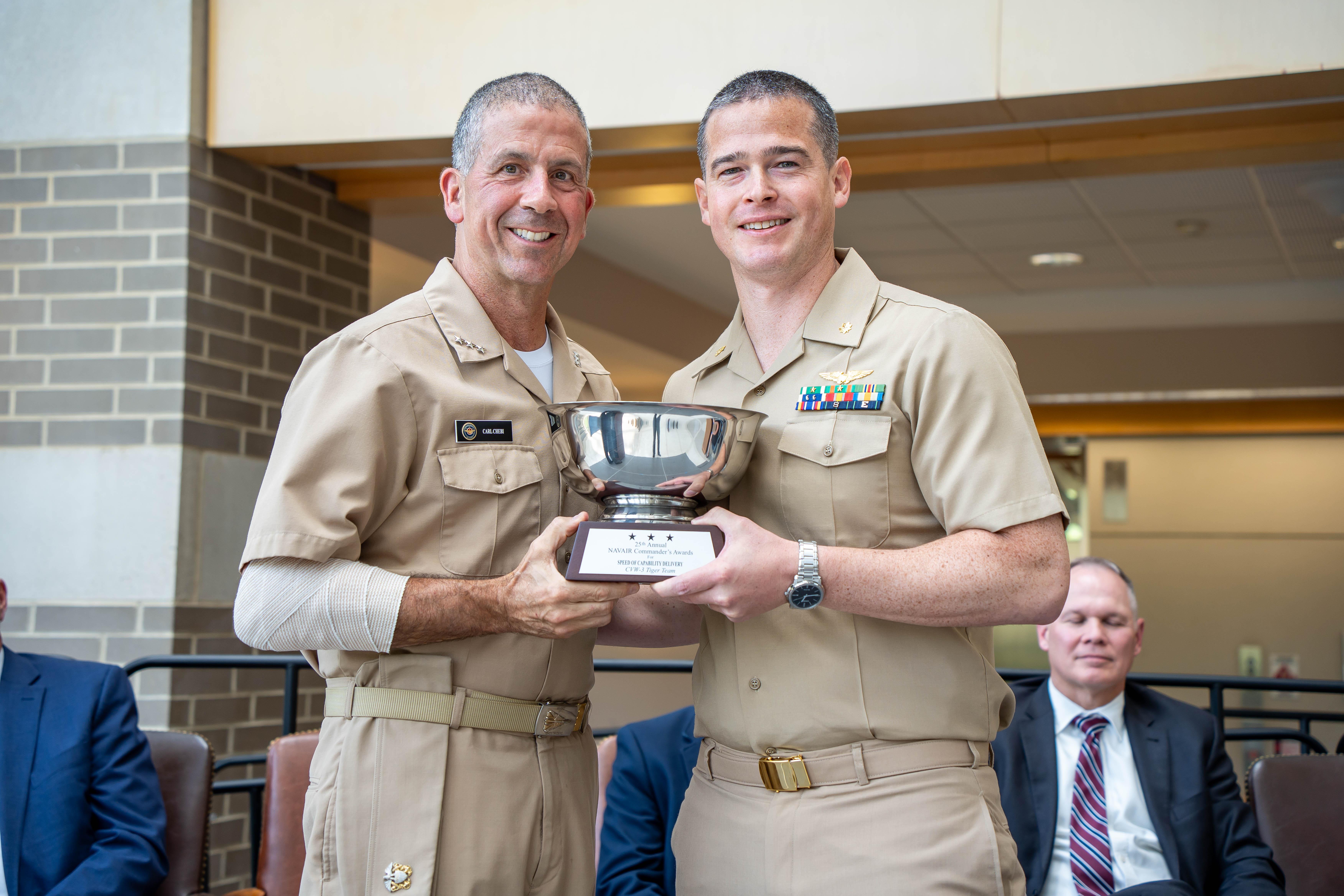 Vice Adm. Carl Chebi presents Lt. Cmdr. Zach Fisher with the NAVAIR Commander’s Speed of Capability Award for the Carrier Air Wing (CVW) 3 Tiger Team