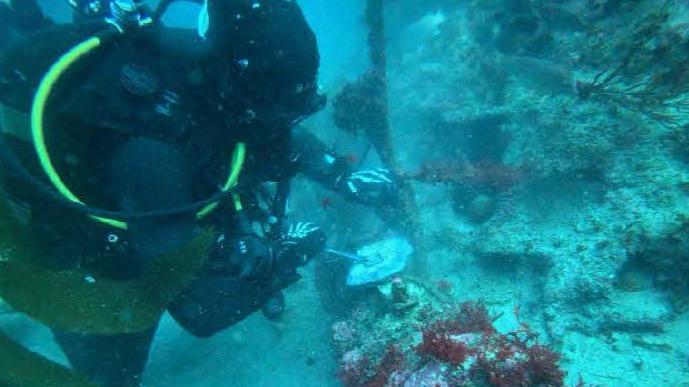 U.S. Navy Seabee Divers from Underwater Construction Team (UCT) 2’s Construction Dive Detachment (CDD) Charlie 80 feet under water