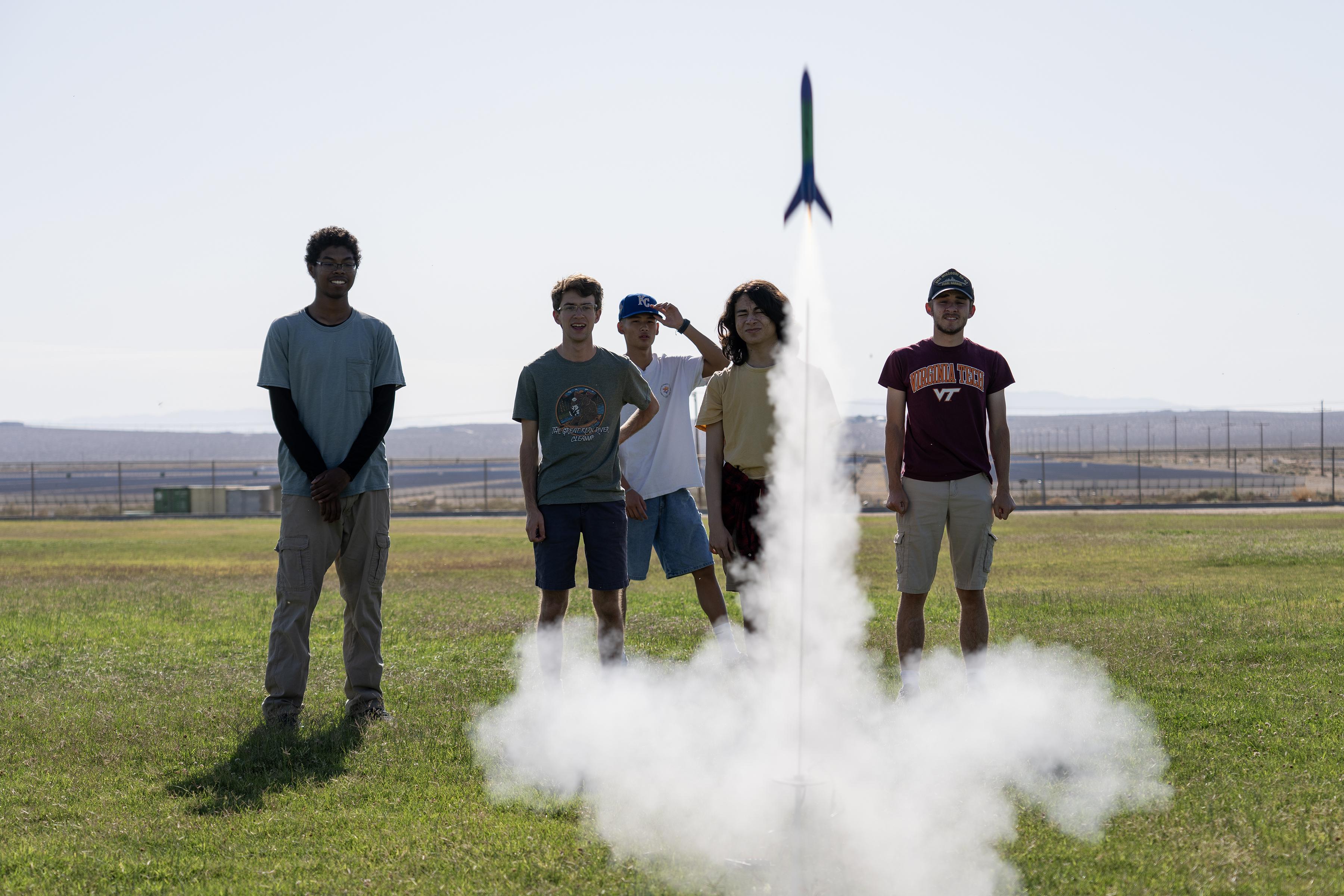 Students at Burroughs High School in Ridgecrest, Calif. watch a second rocket launch on May 29 after using painter’s tape to repair damage from a previous failed attempt. The STEM partnership with the Naval Air Warfare Center Weapons Division teaches students that failure can lead to learning. (U.S. Navy photo by Ryan Smith)