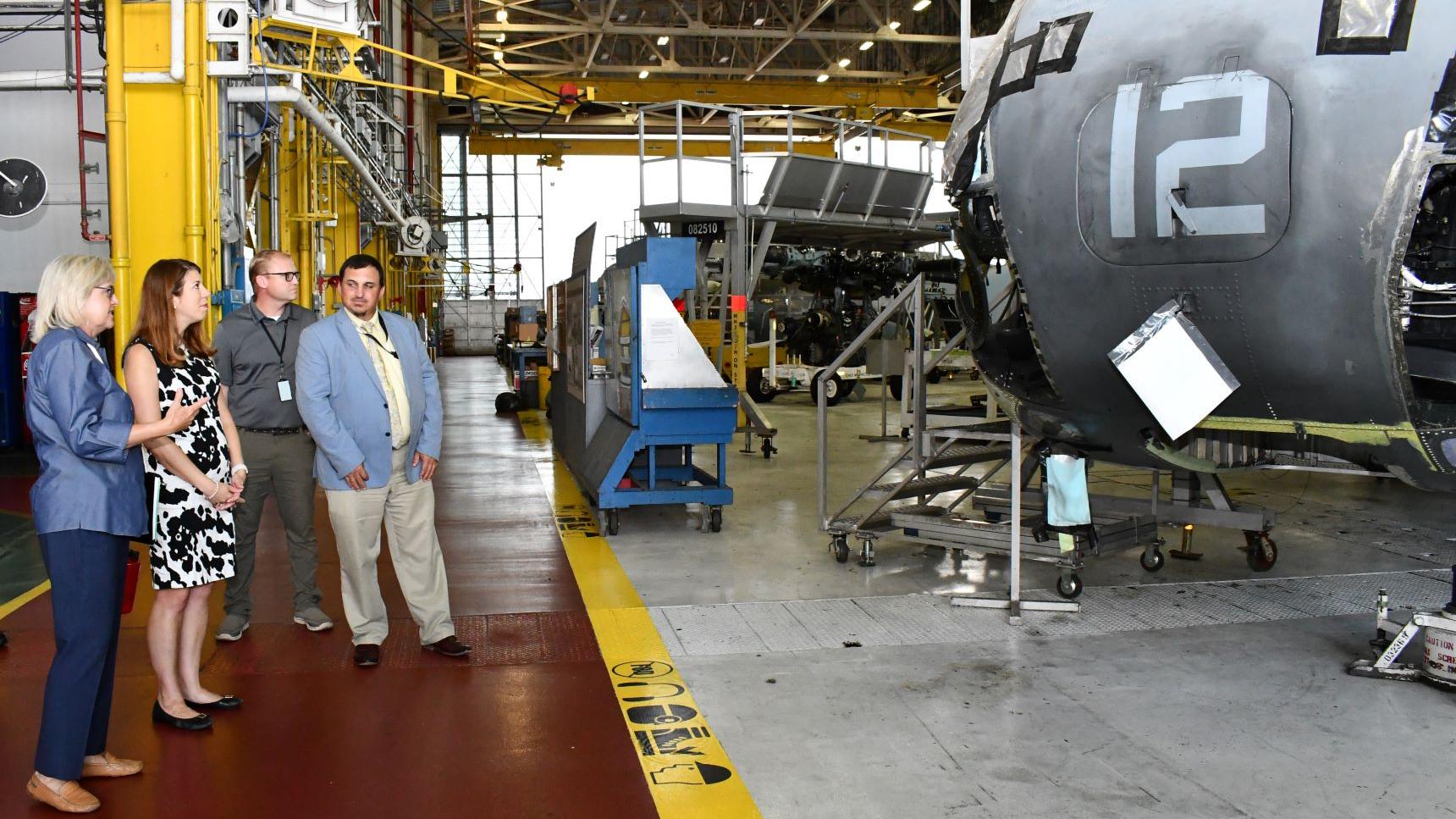 Group surveys H-53 aircraft production line in hangar space